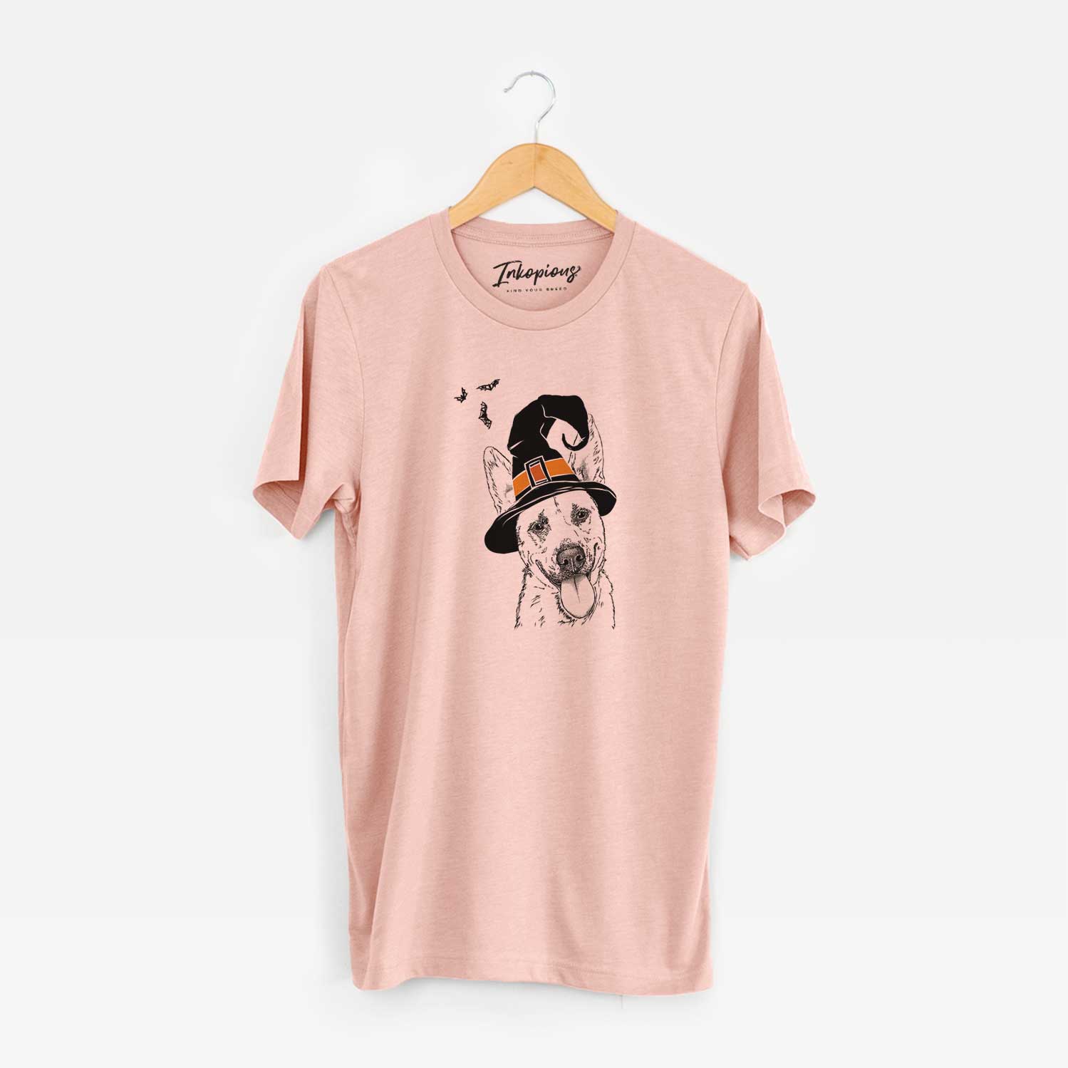 Hand-drawn sketch of Charlie the Mixed Breed wearing a witch hat on a Peach Unisex crewneck