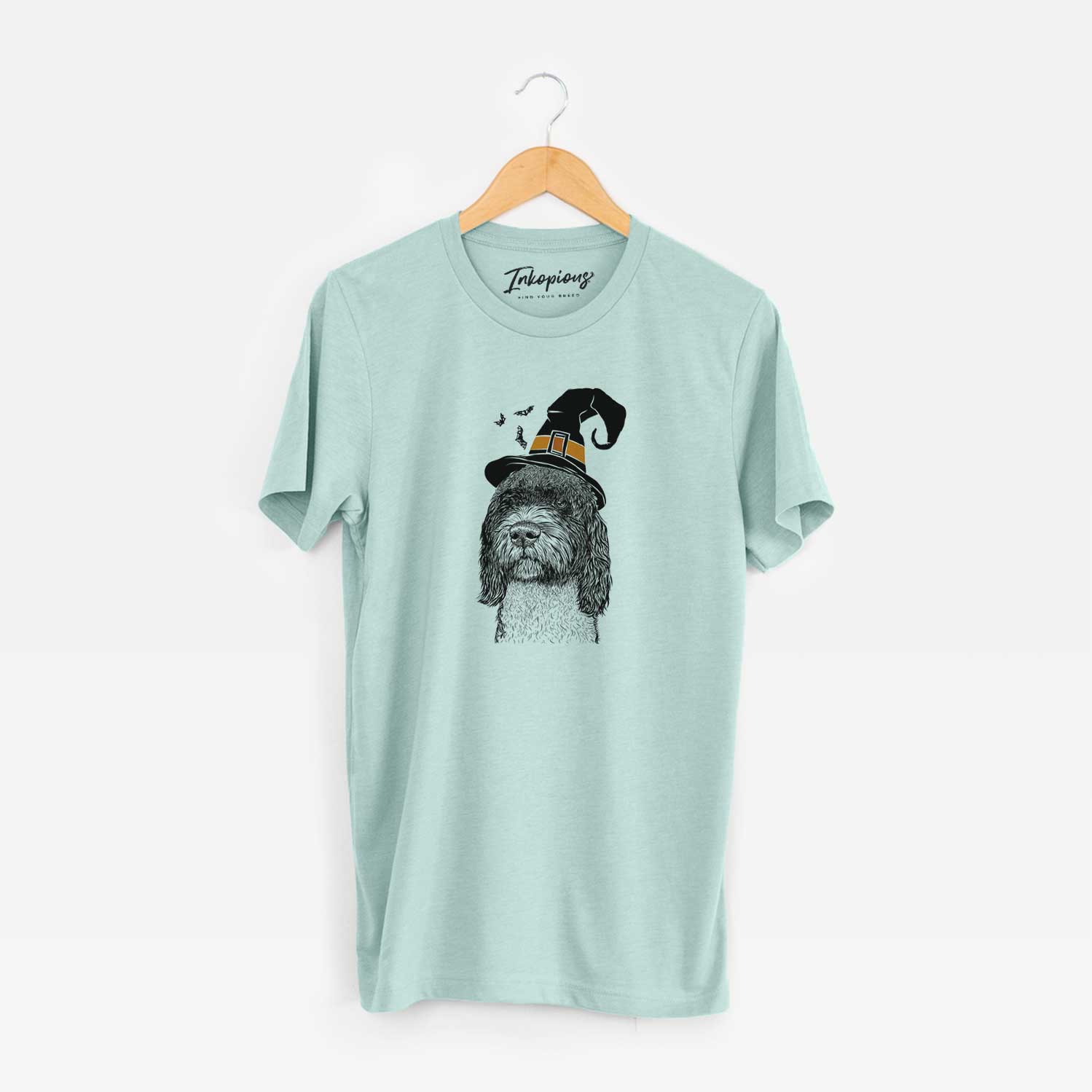 Hand-drawn sketch of Chris the Portuguese Water Dog wearing a witch hat on a Heather Sage Unisex crewneck