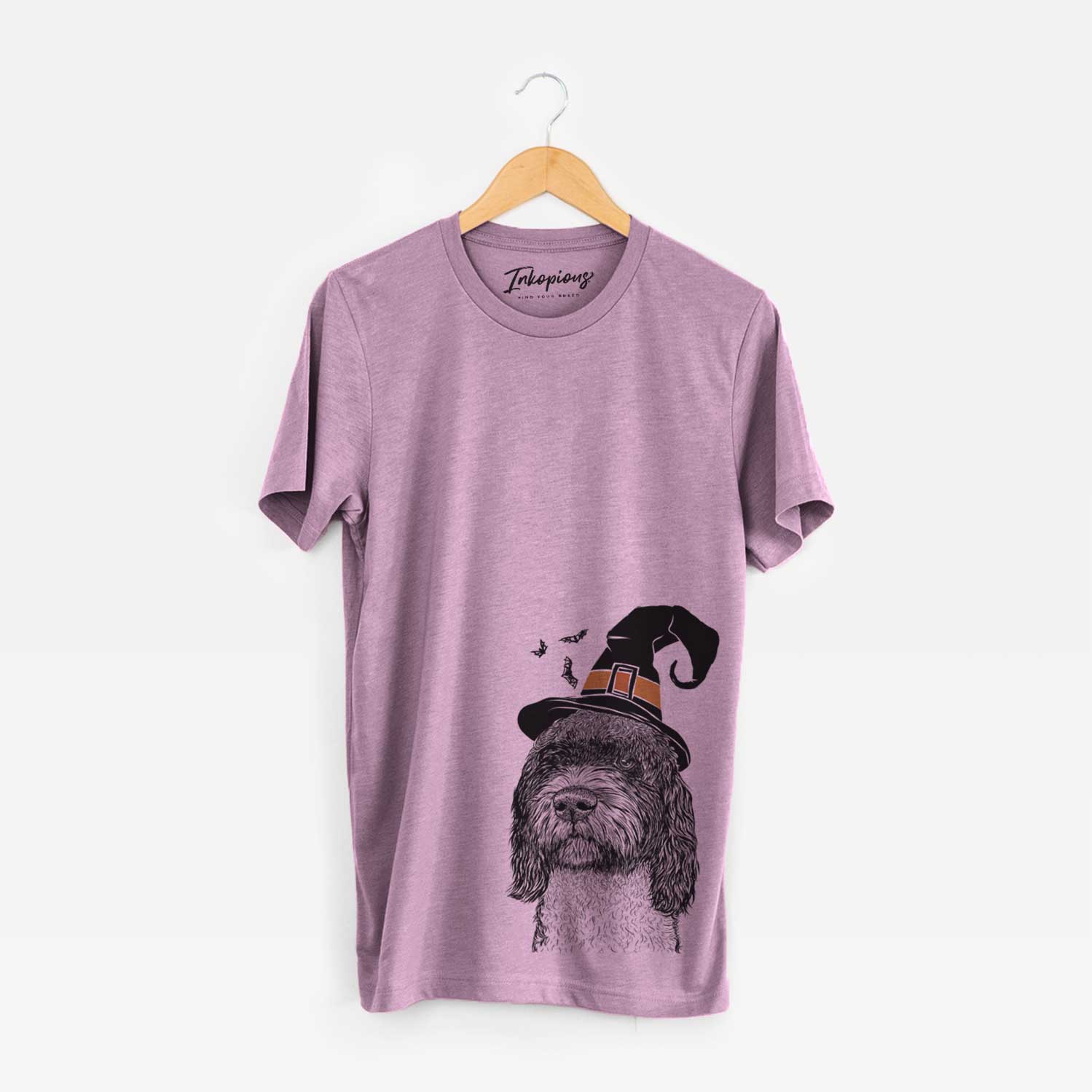 Hand-drawn sketch of Chris the Portuguese Water Dog wearing a witch hat on an Orchid Unisex crewneck