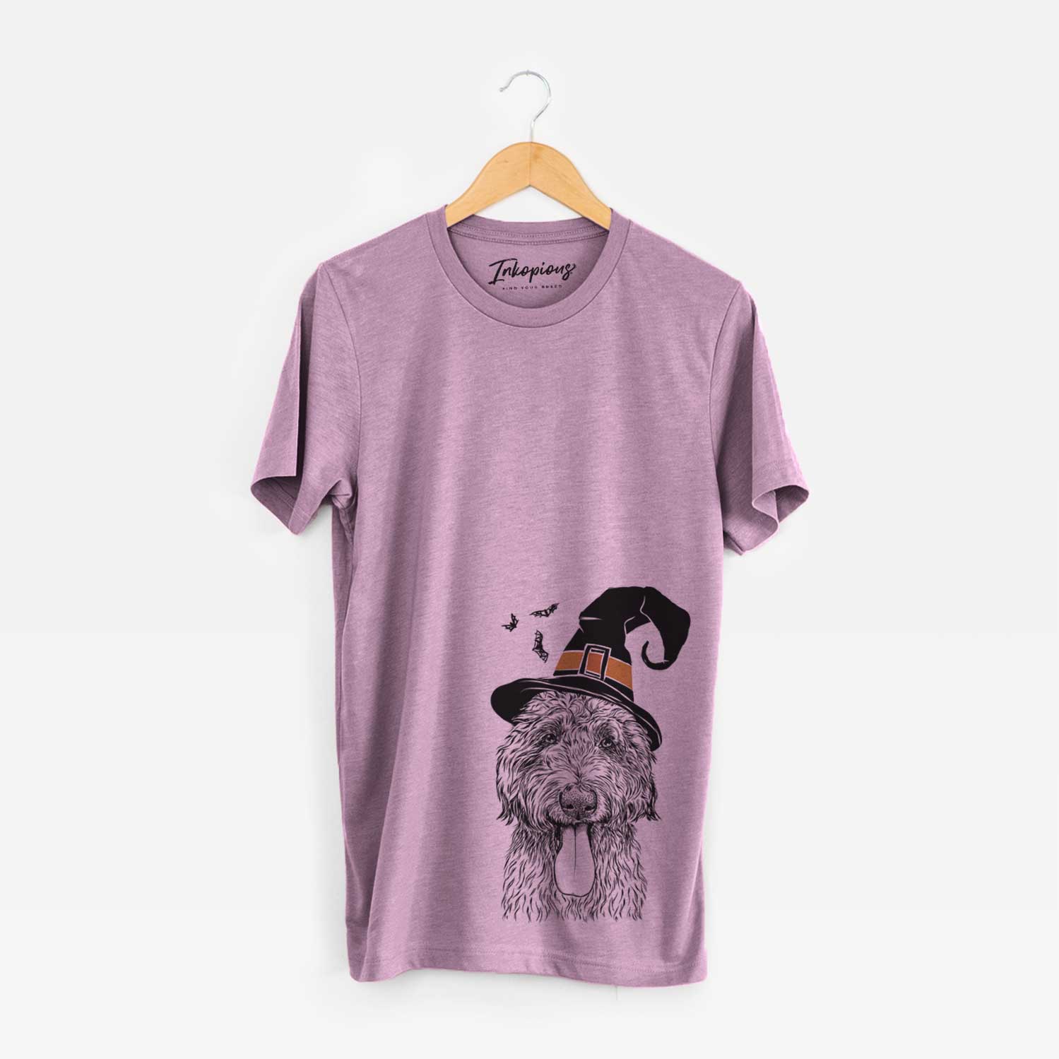 Hand-drawn sketch of CiCi Paulk the Aussiedoodle wearing a witch hat on an Orchid Unisex crewneck