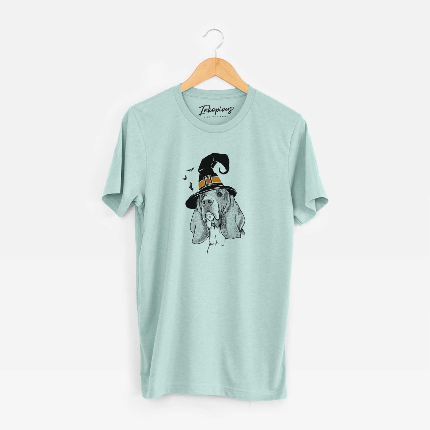 Hand-drawn sketch of Cooper the Basset Hound wearing a witch hat on a Heather Sage Unisex crewneck
