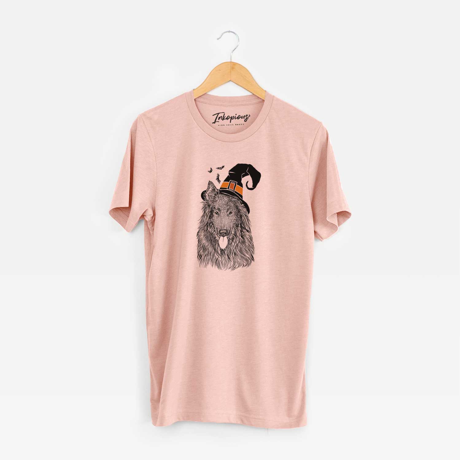 Hand-drawn sketch of Daan the Belgian Shepherd wearing a witch hat on a Peach Unisex crewneck