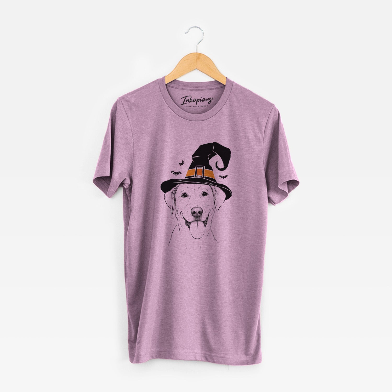 Hand-drawn sketch of Daisy the Labrador Retriever wearing a witch hat on an Orchid Unisex crewneck