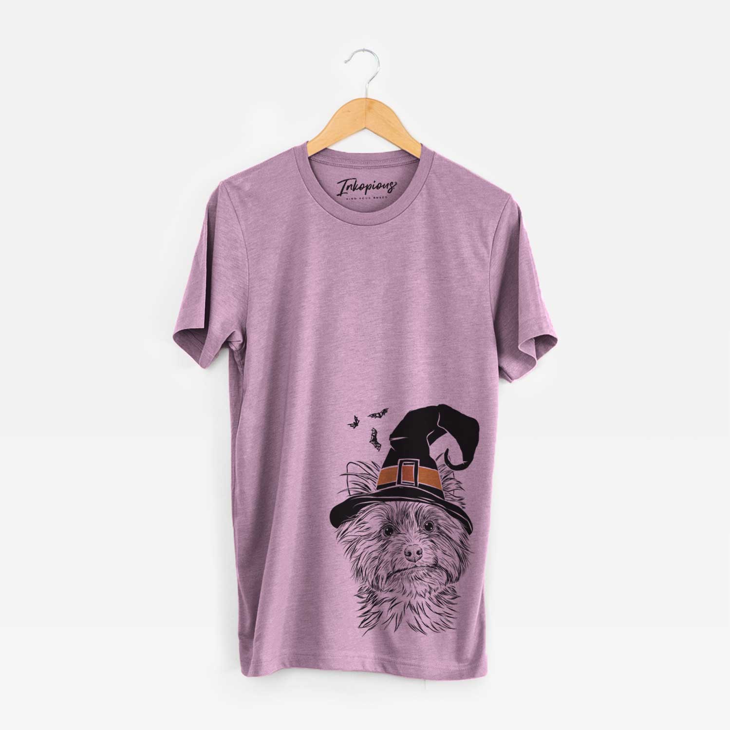 Hand-drawn sketch of Dakota the Yorkshire Terrier wearing a witch hat on an Orchid Unisex crewneck
