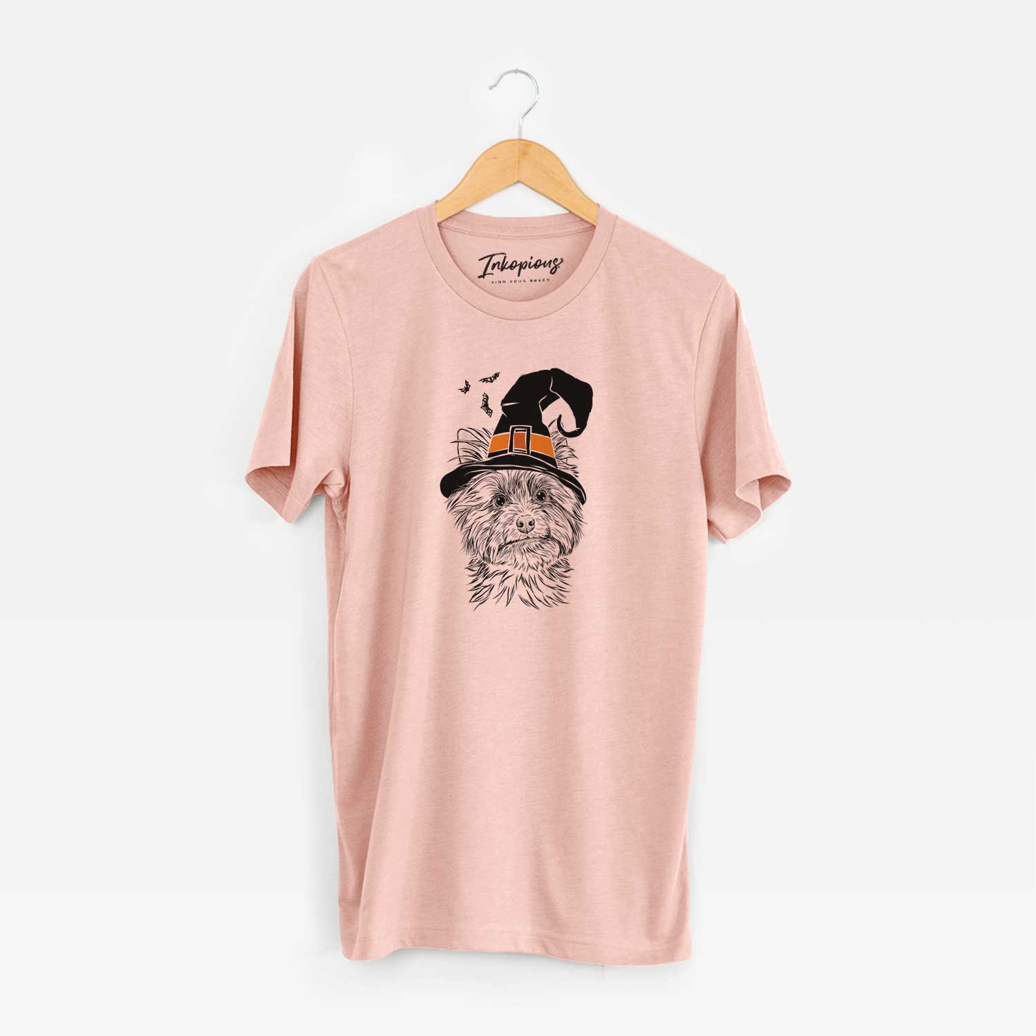 Hand-drawn sketch of Dakota the Yorkshire Terrier wearing a witch hat on a Peach Unisex crewneck