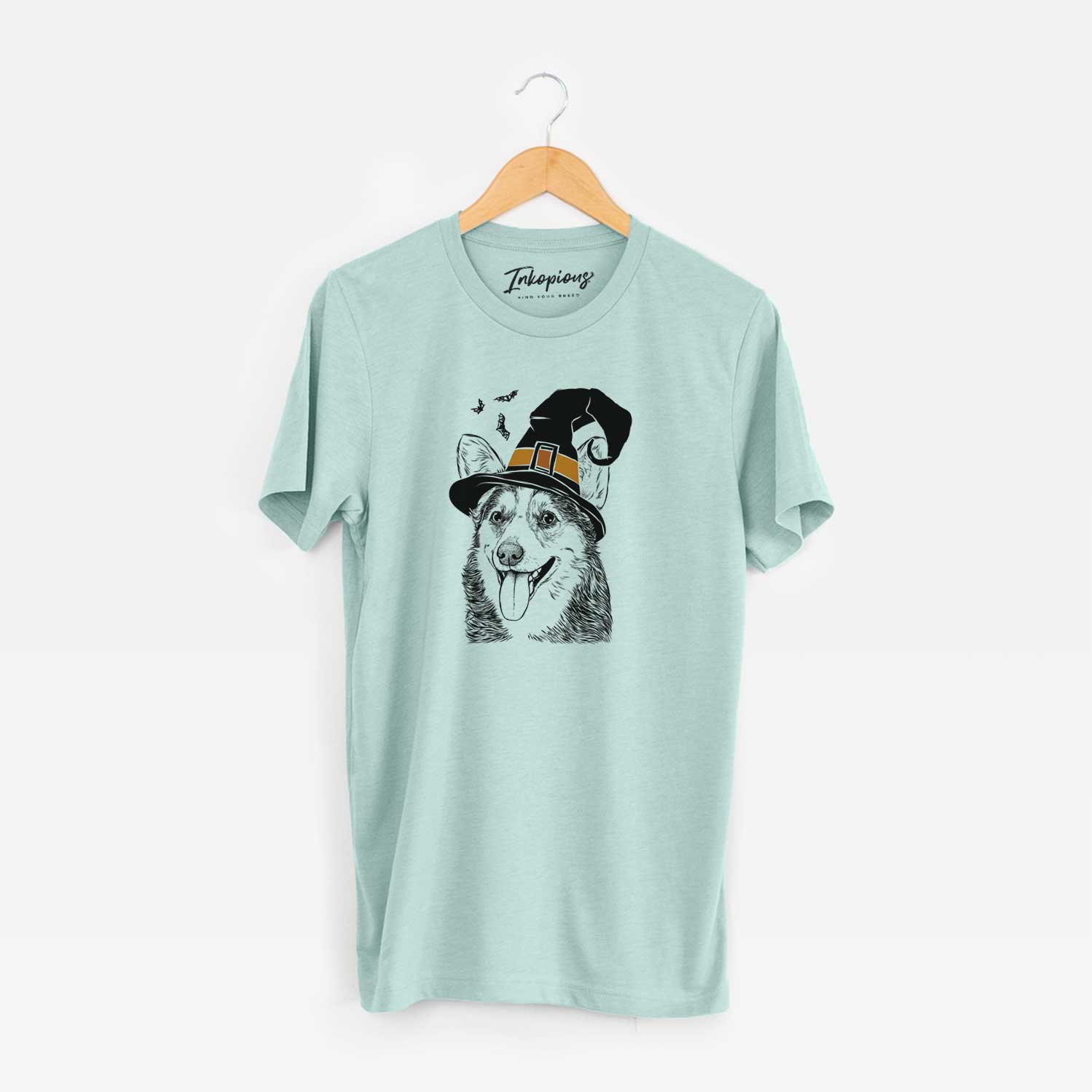 Hand-drawn sketch of Darma the Corgi wearing a witch hat on a Heather Sage Unisex crewneck
