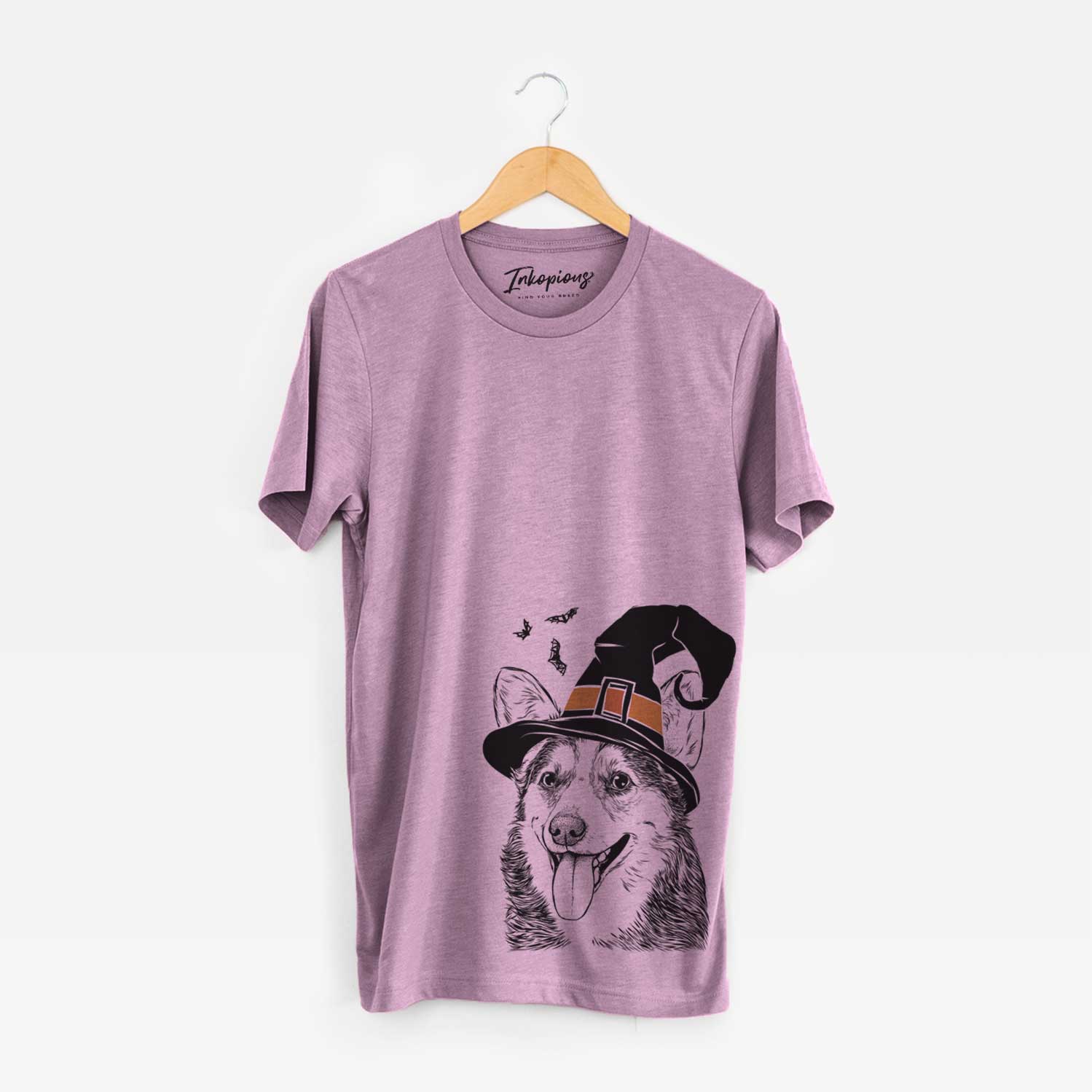 Hand-drawn sketch of Darma the Corgi wearing a witch hat on an Orchid Unisex crewneck