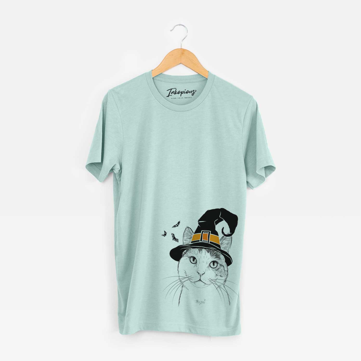 Hand-drawn sketch of Denver the Calico Cat wearing a witch hat on a Heather Sage Unisex crewneck