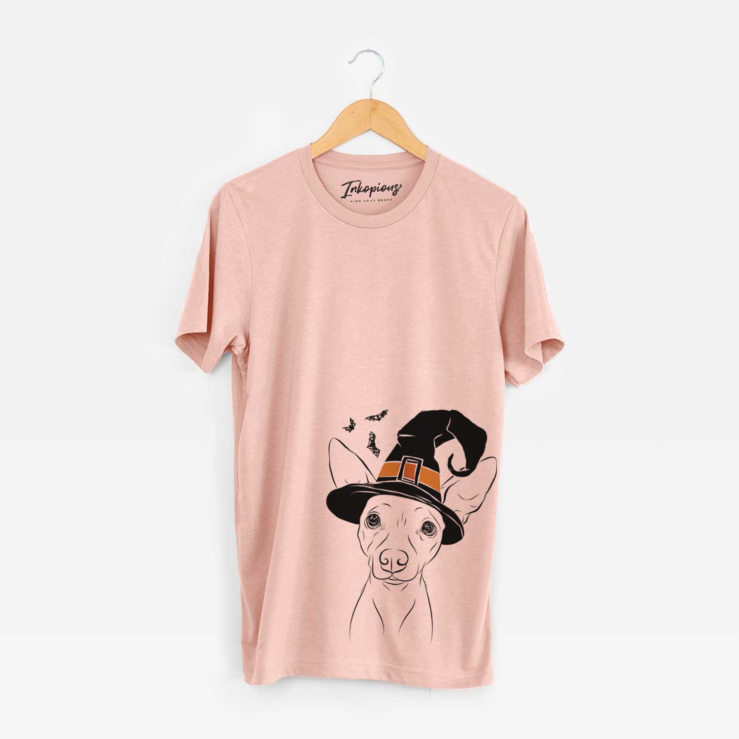Hand-drawn sketch of Desi the American Hairless Terrier wearing a witch hat on a Peach Unisex crewneck