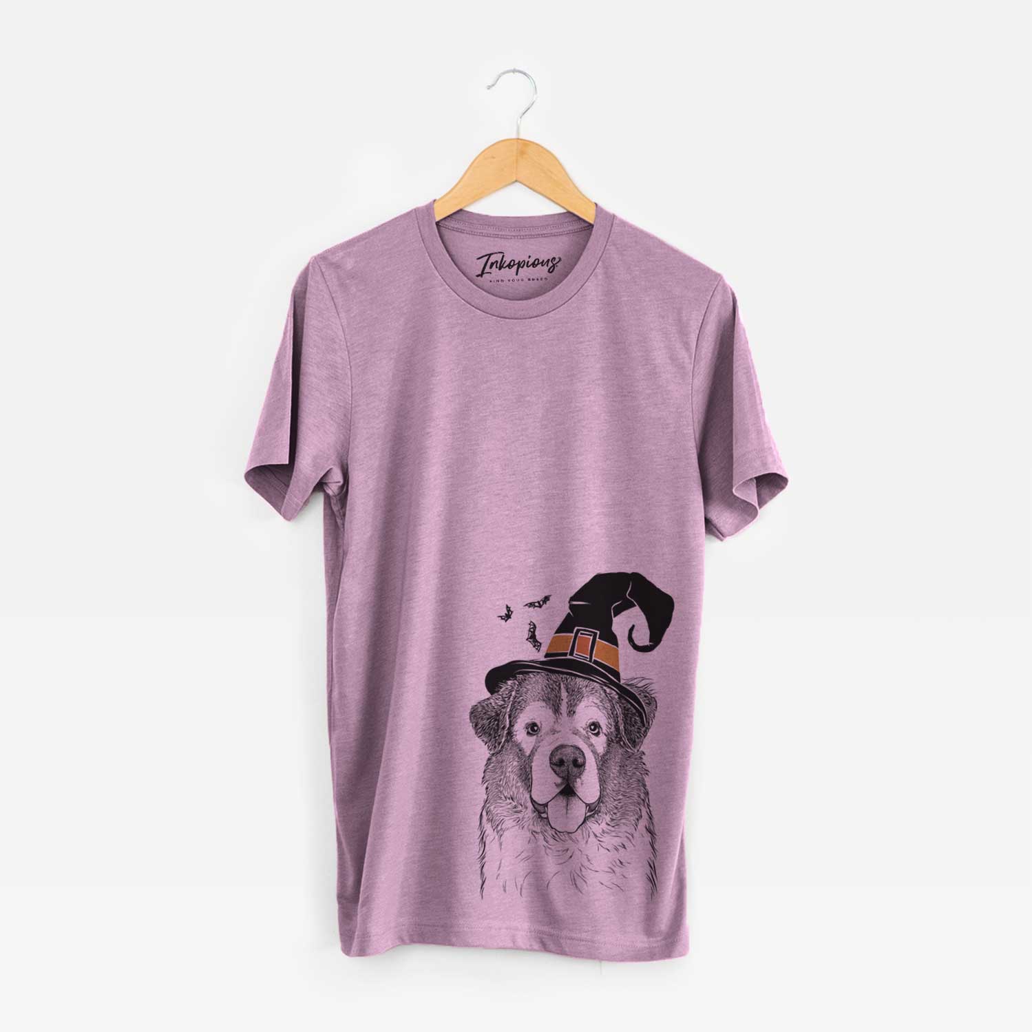 Hand-drawn sketch of Dilly the Saint Bernard wearing a witch hat on an Orchid Unisex crewneck