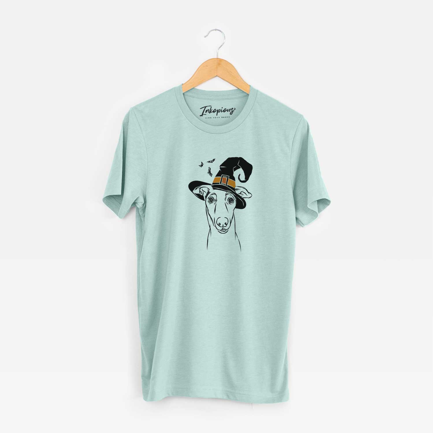 Hand-drawn sketch of Diva the Greyhound wearing a witch hat on a Heather Sage Unisex crewneck