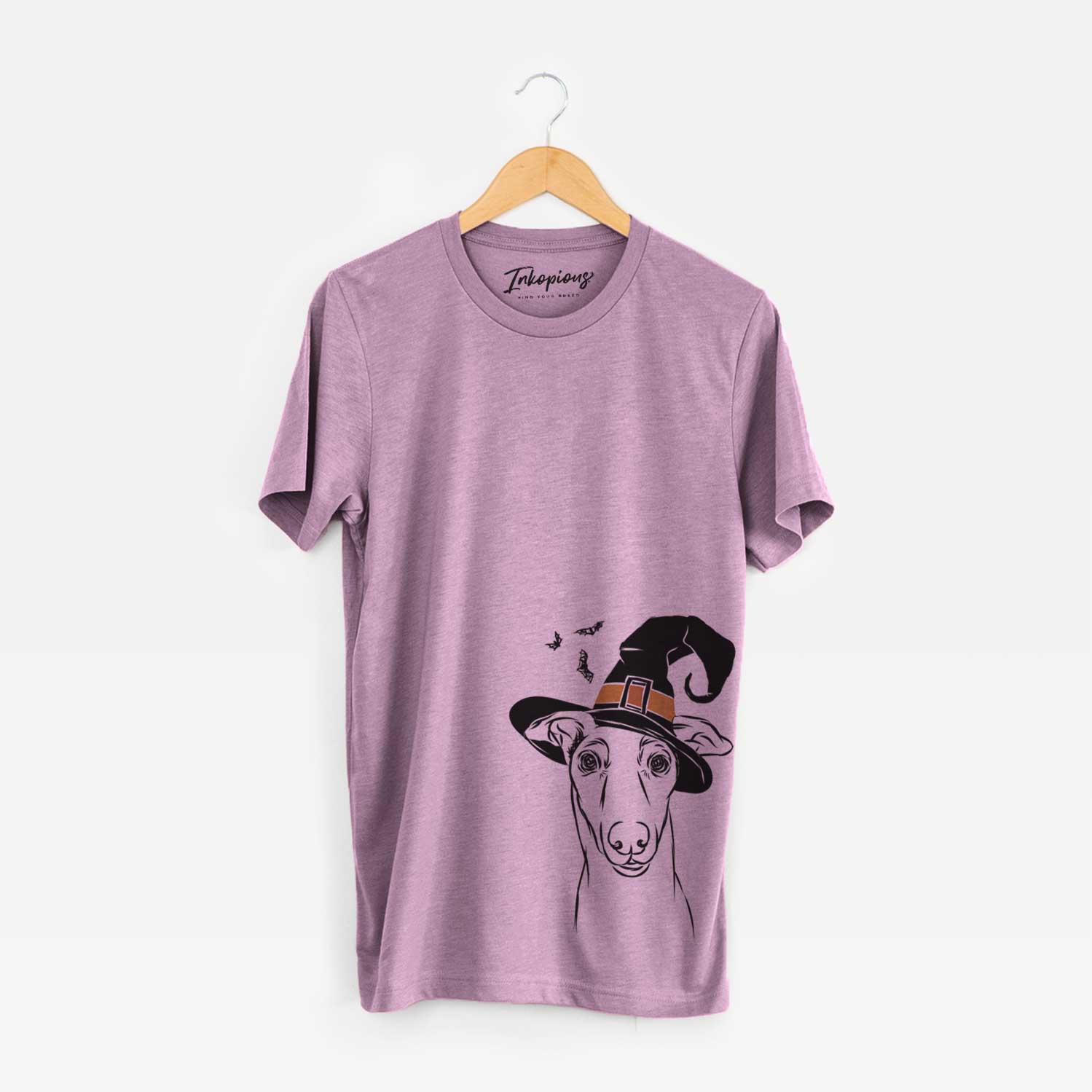 Hand-drawn sketch of Diva the Greyhound wearing a witch hat on an Orchid Unisex crewneck