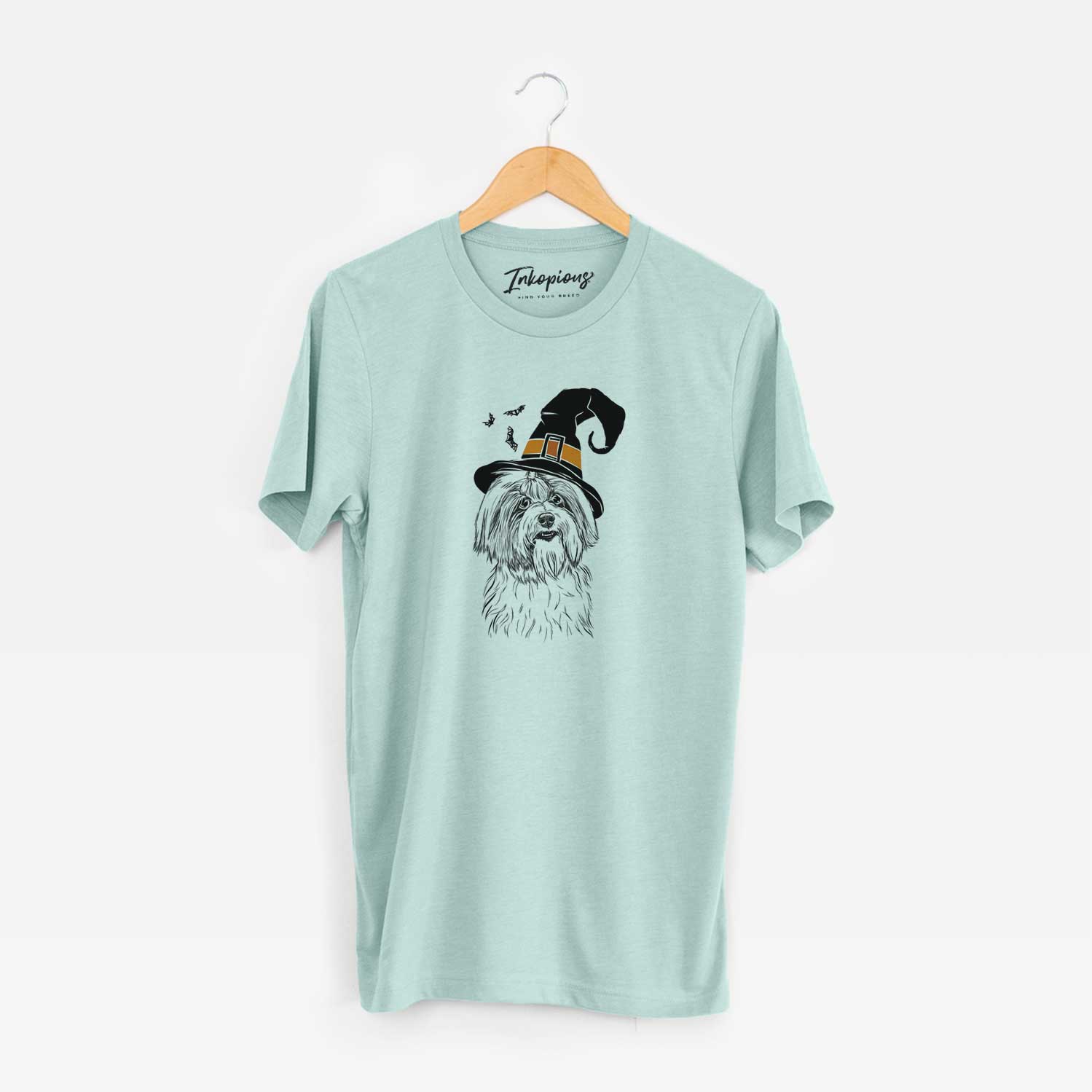 Hand-drawn sketch of Dooley the Havanese wearing a witch hat on a Heather Sage Unisex crewneck