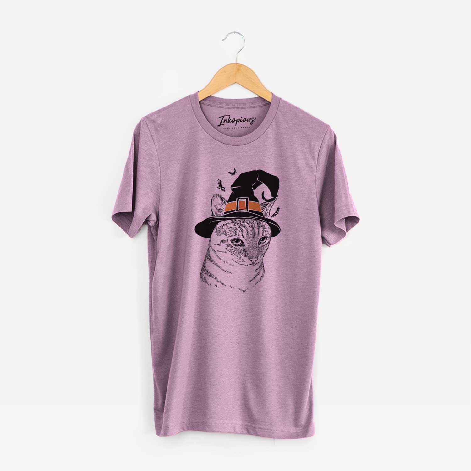 Hand-drawn sketch of Dora the Tabby Cat wearing a witch hat on an Orchid Unisex crewneck