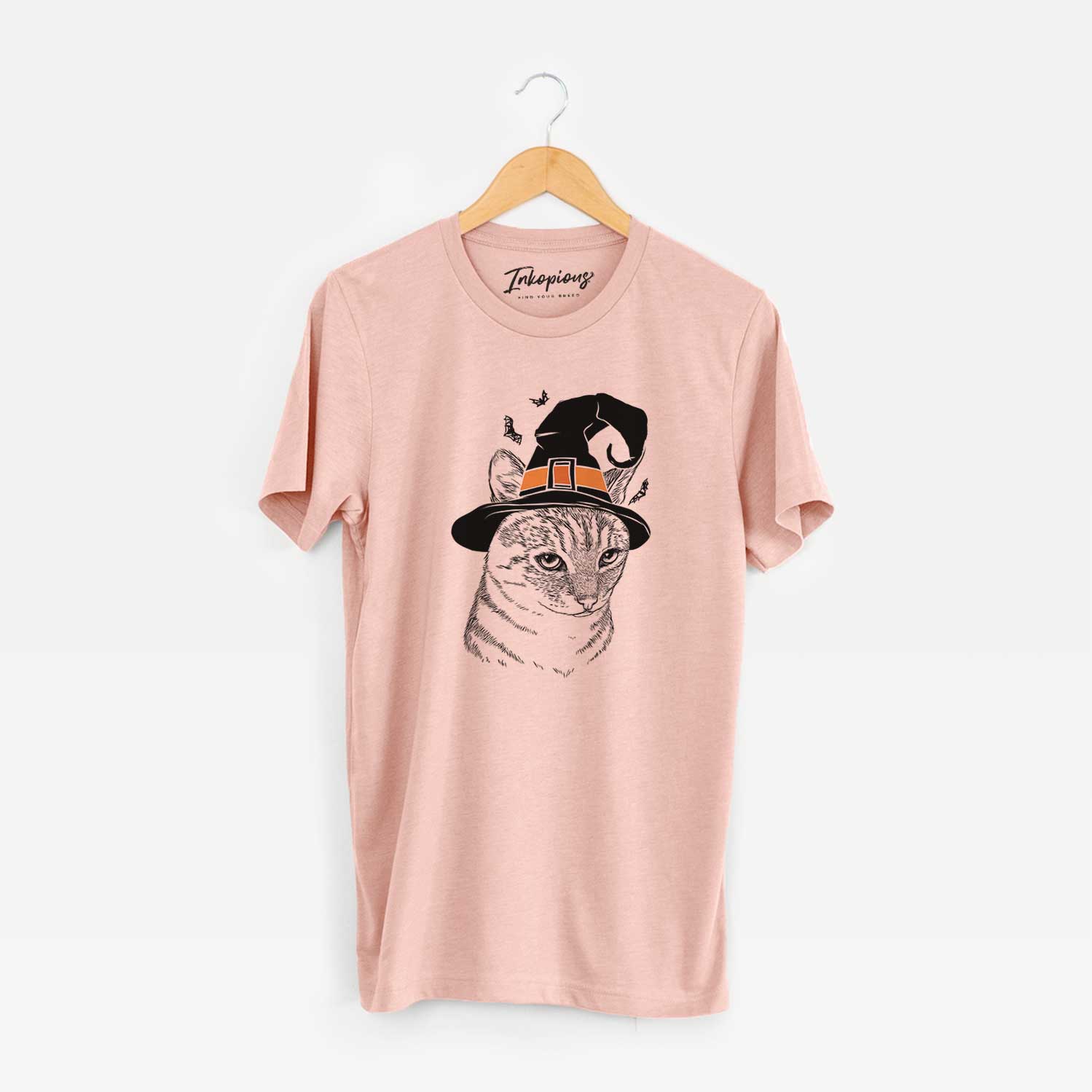 Hand-drawn sketch of Dora the Tabby Cat wearing a witch hat on a Peach Unisex crewneck