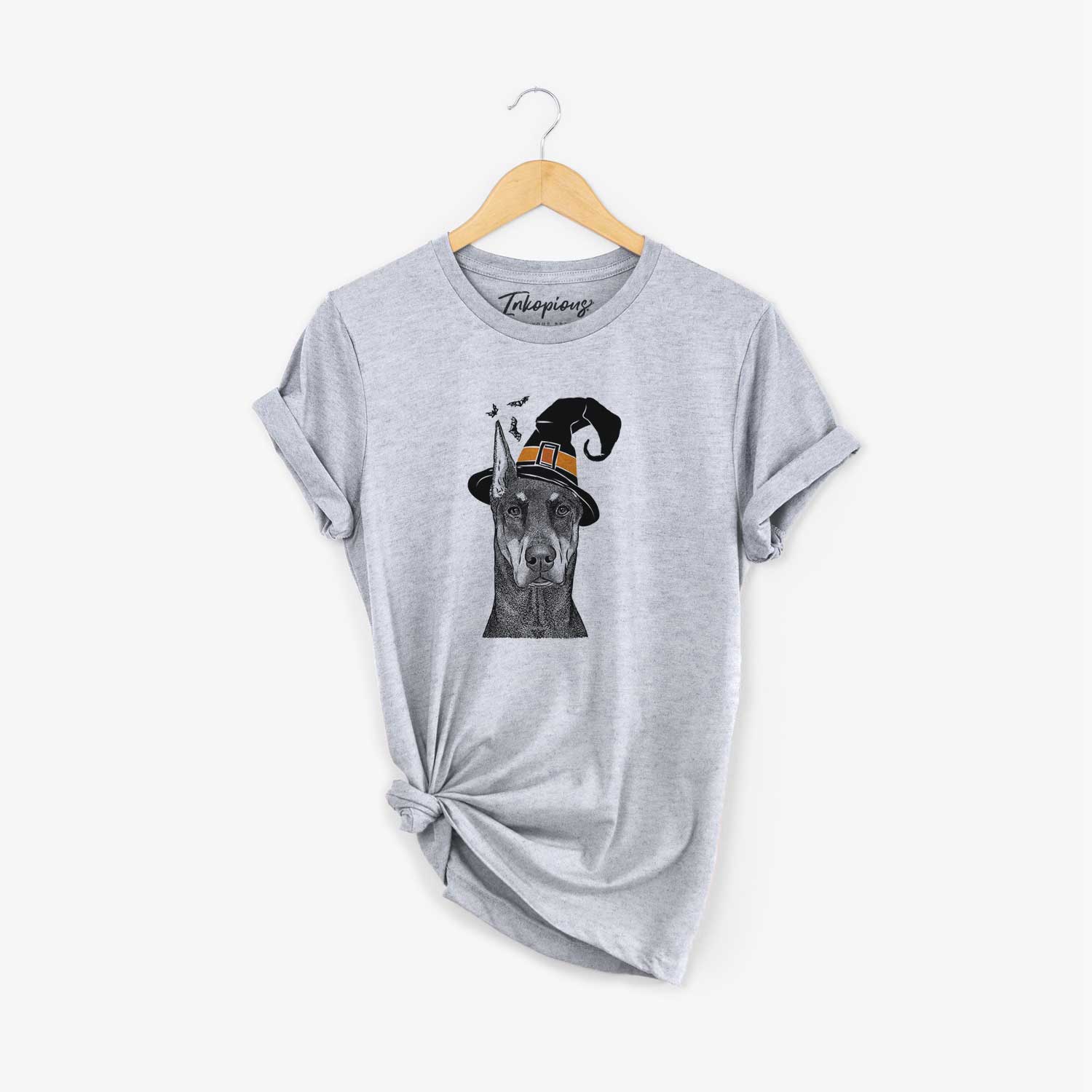 Hand-drawn sketch of Drake the Doberman Pinscher wearing a witch hat on a Grey Unisex crewneck