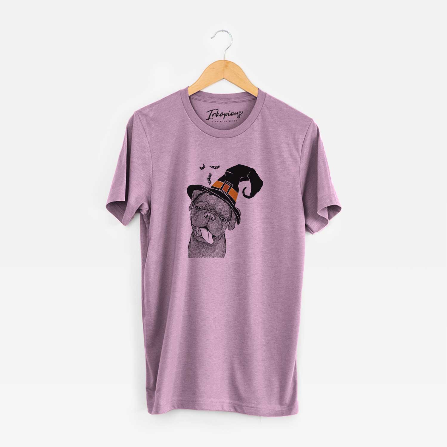 Hand-drawn sketch of Dudley Danger the Pug wearing a witch hat on an Orchid Unisex crewneck