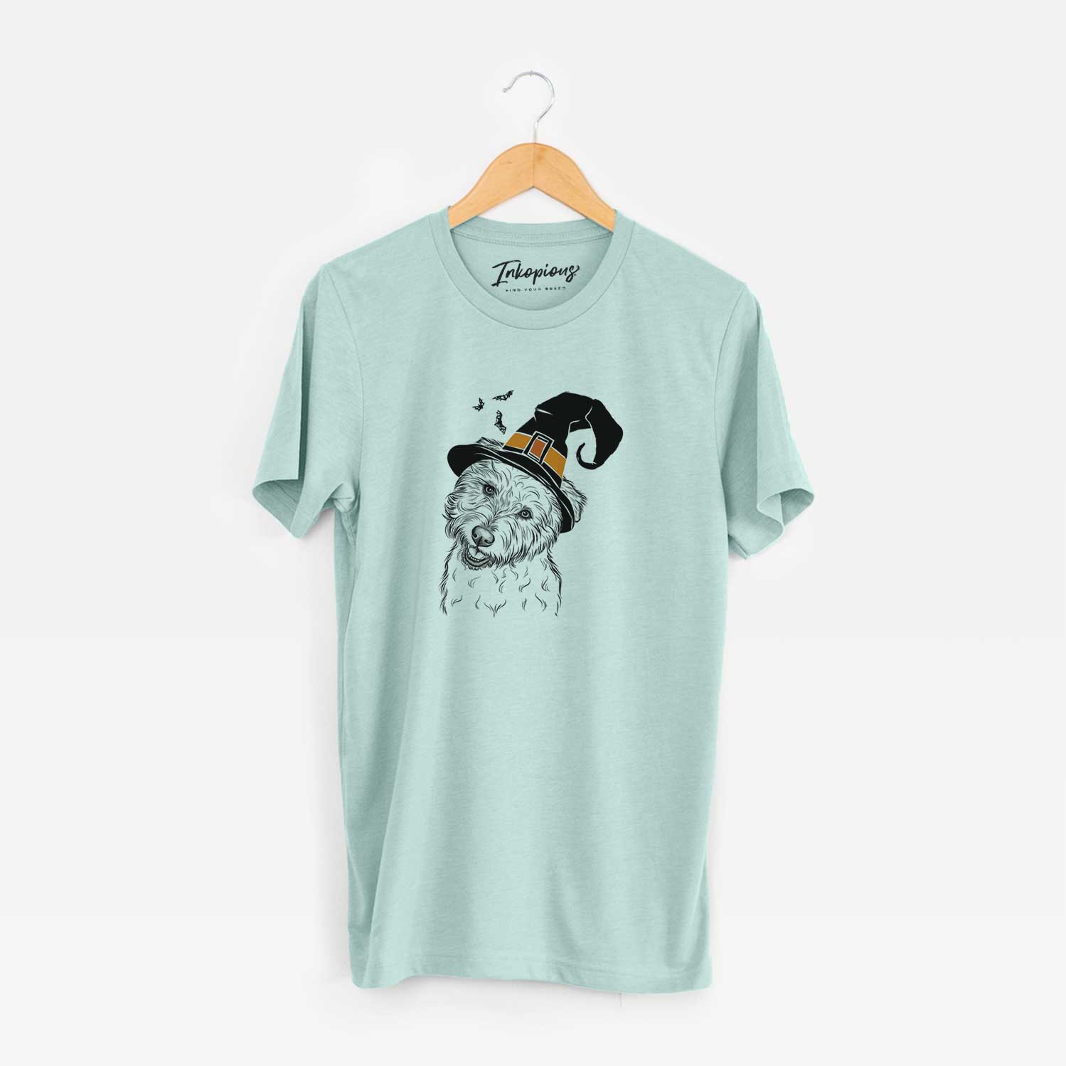 Hand-drawn sketch of Duffy the Glen of Imaal Terrier wearing a witch hat on a Heather Sage Unisex crewneck