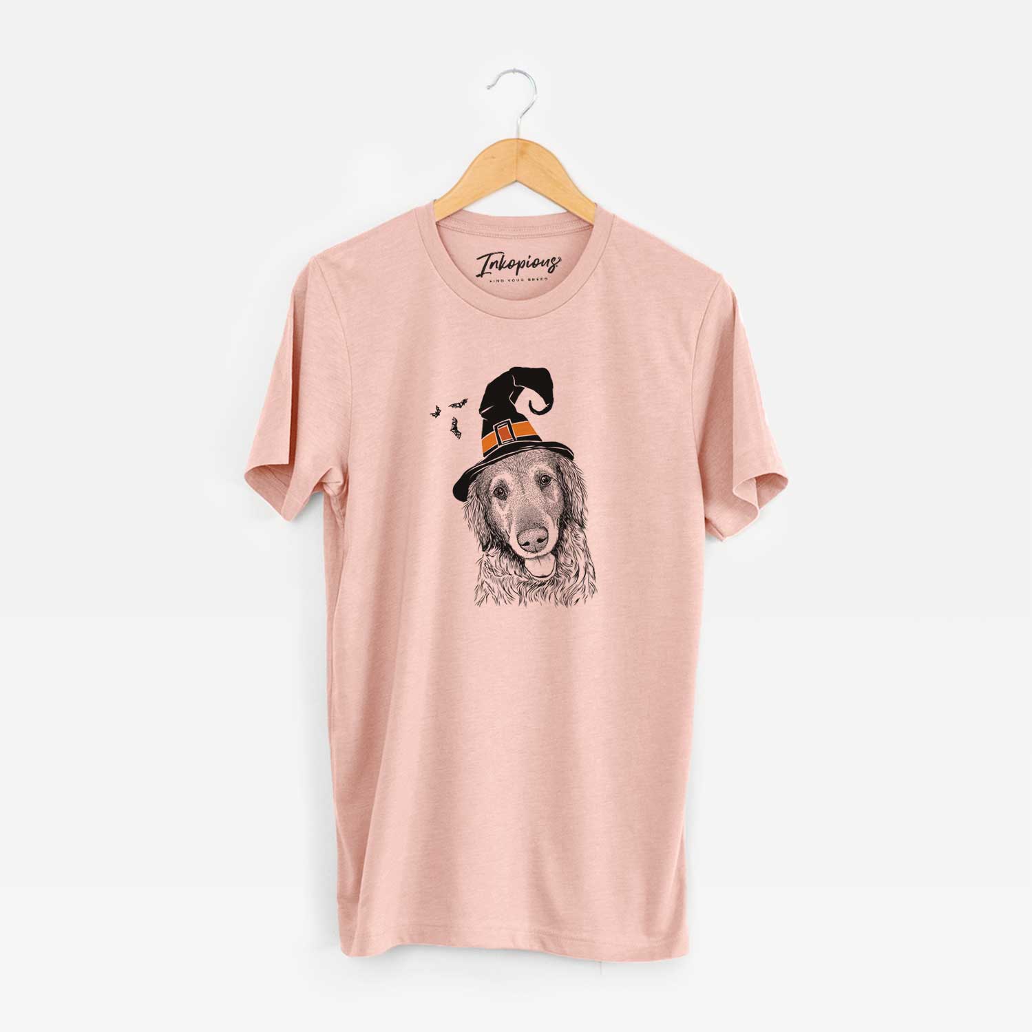 Hand-drawn sketch of Duncan the Golden Retriever wearing a witch hat on a Peach Unisex crewneck
