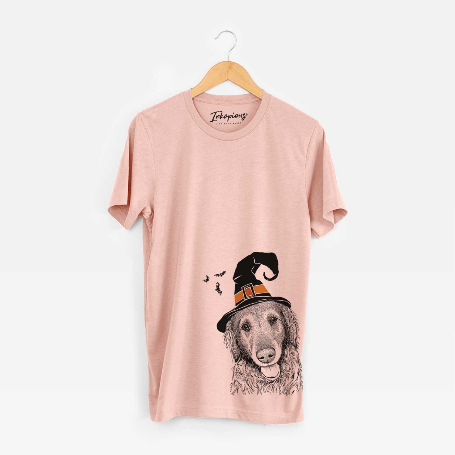 Hand-drawn sketch of Duncan the Golden Retriever wearing a witch hat on a Peach Unisex crewneck