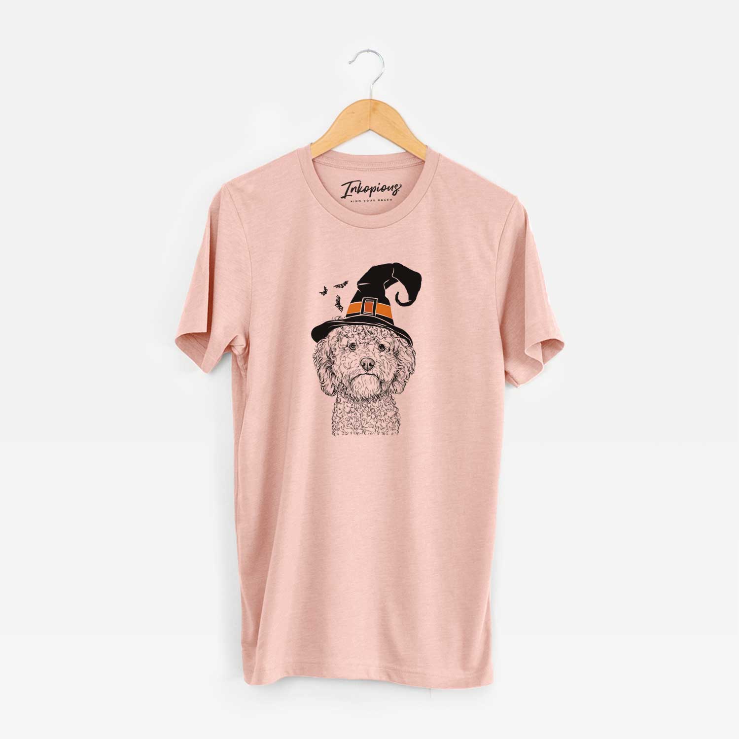 Hand-drawn sketch of Edgar the Shihpoo wearing a witch hat on a Peach Unisex crewneck