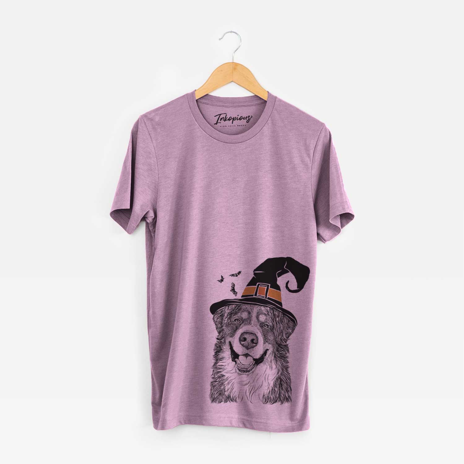 Hand-drawn sketch of Eiger the Bernese Mountain Dog wearing a witch hat on an Orchid Unisex crewneck