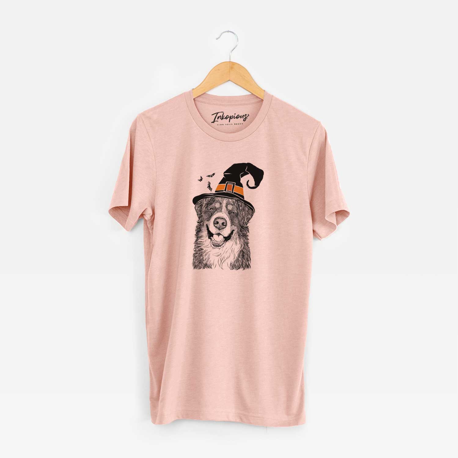 Hand-drawn sketch of Eiger the Bernese Mountain Dog wearing a witch hat on a Peach Unisex crewneck