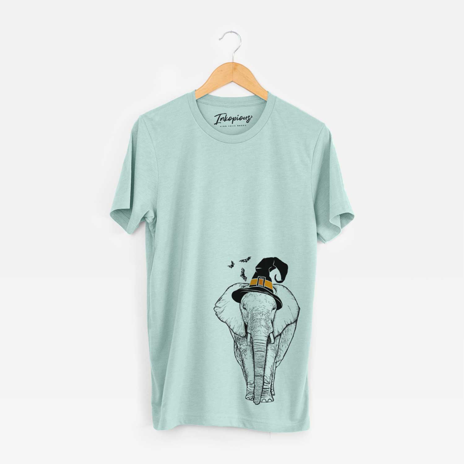 Hand-drawn sketch of Ella the Elephant wearing a witch hat on a Heather Sage Unisex crewneck