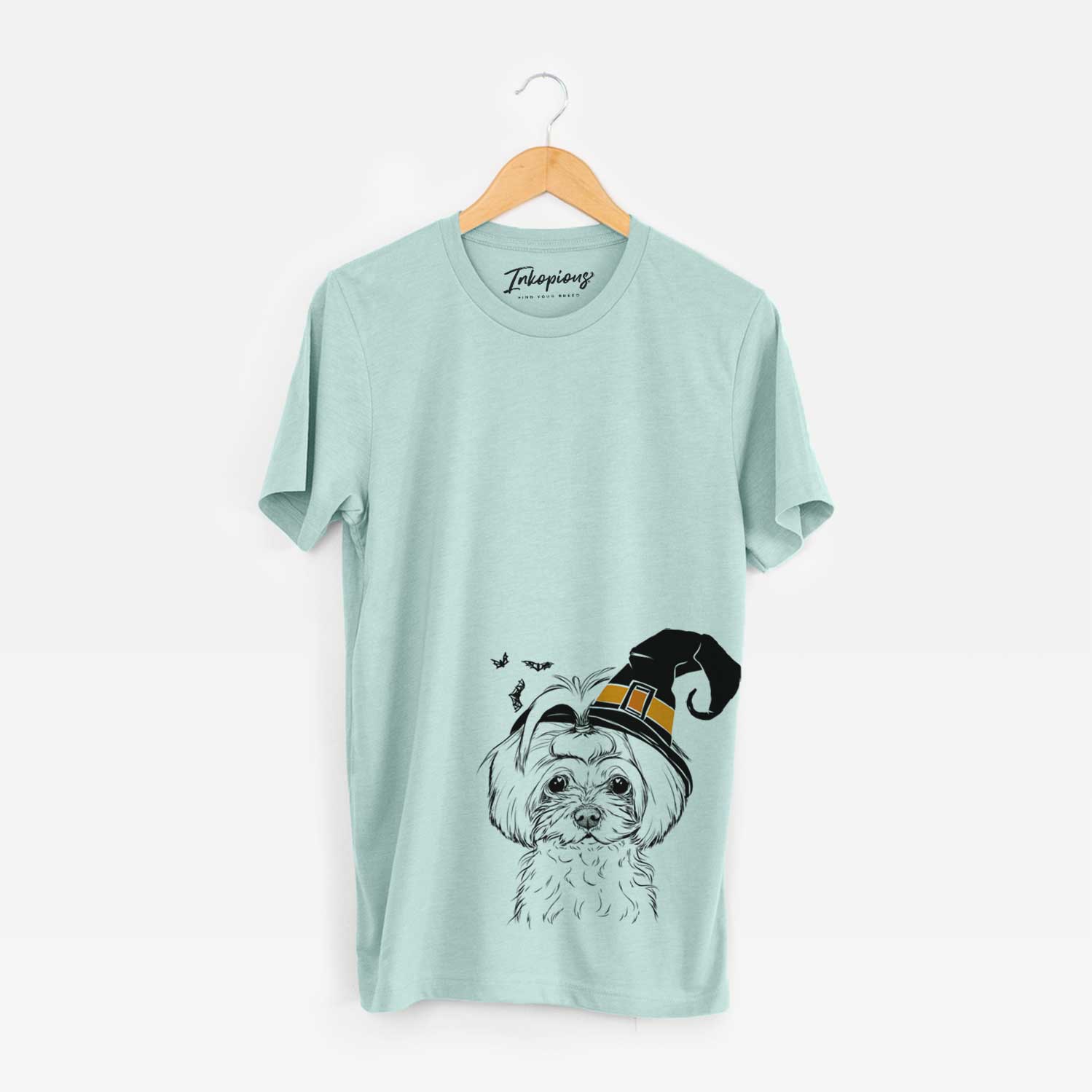 Hand-drawn sketch of Ellie the Maltese wearing a witch hat on a Heather Sage Unisex crewneck