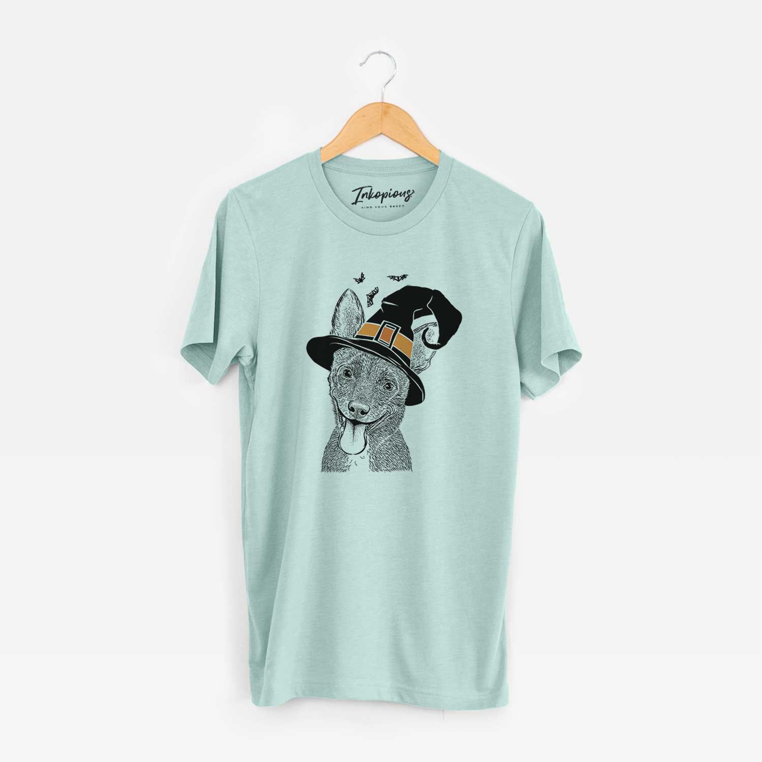 Hand-drawn sketch of Elvira the Terrier Mix wearing a witch hat on a Heather Sage Unisex crewneck