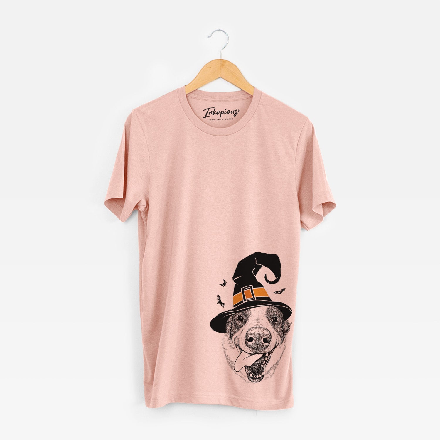 Hand-drawn sketch of Elwood the Border Collie wearing a witch hat on a Peach Unisex crewneck