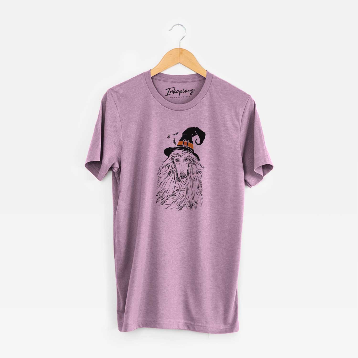 Hand-drawn sketch of Fabio the Afghan Hound wearing a witch hat on an Orchid Unisex crewneck