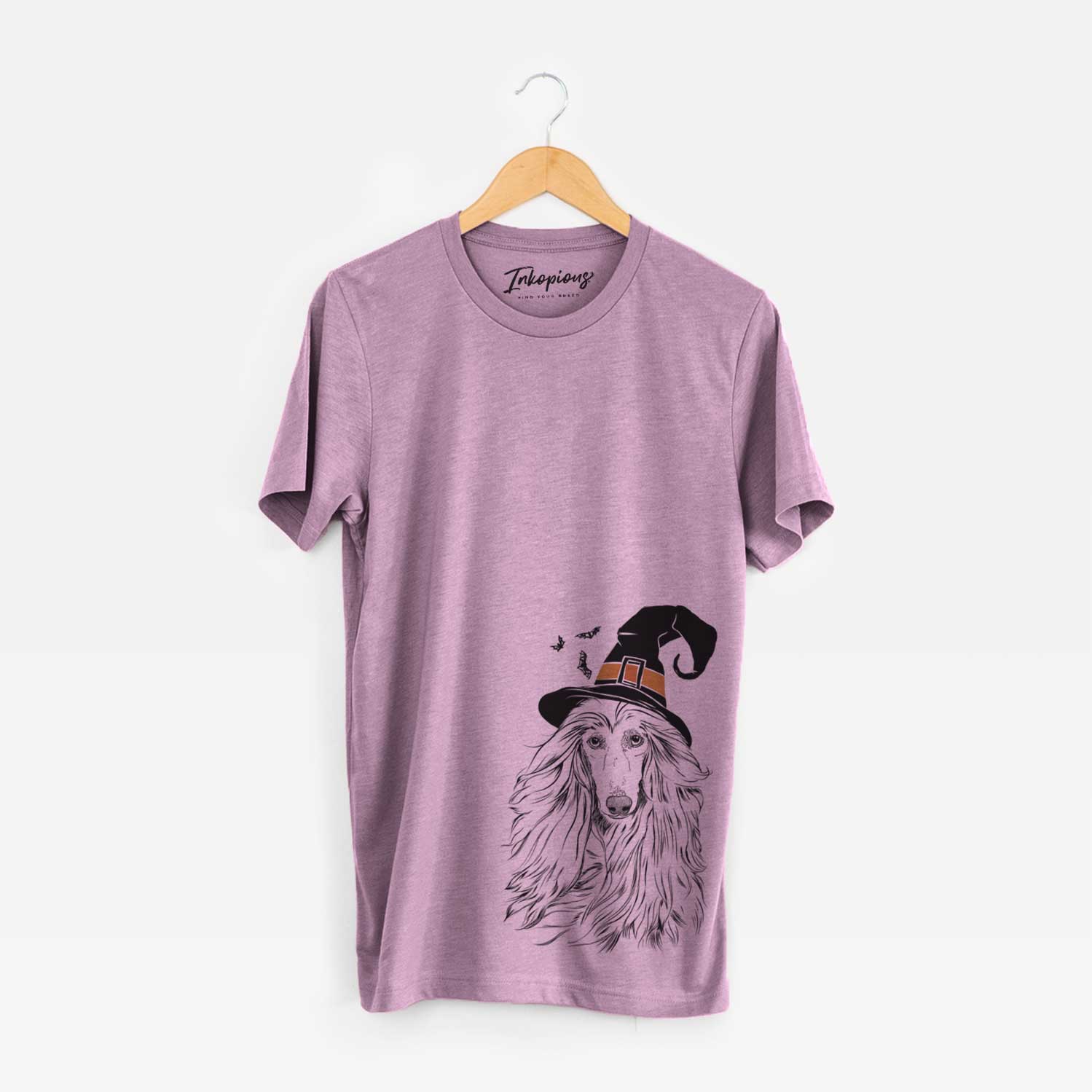 Hand-drawn sketch of Fabio the Afghan Hound wearing a witch hat on an Orchid Unisex crewneck