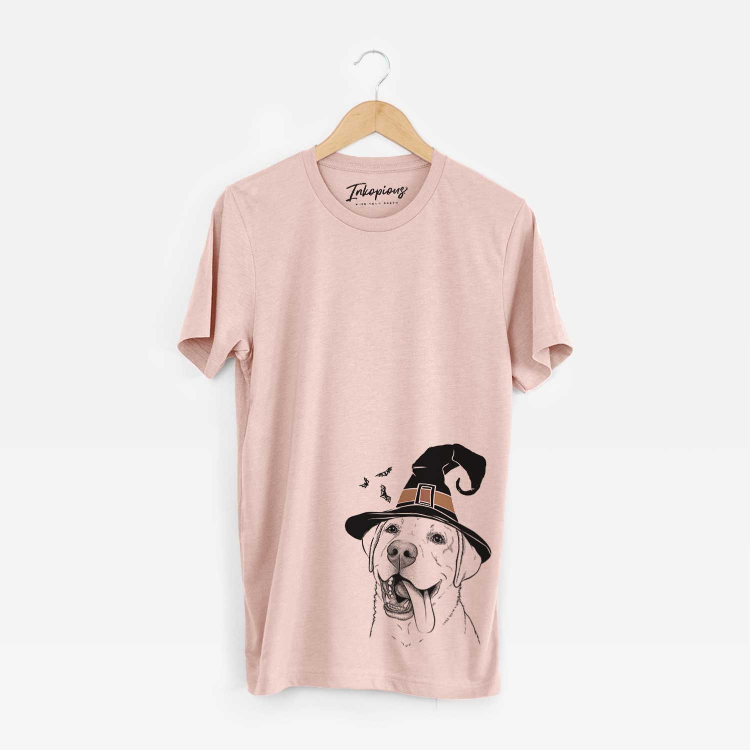 Hand-drawn sketch of Finn the Labrador Retriever wearing a witch hat on a Peach Unisex crewneck