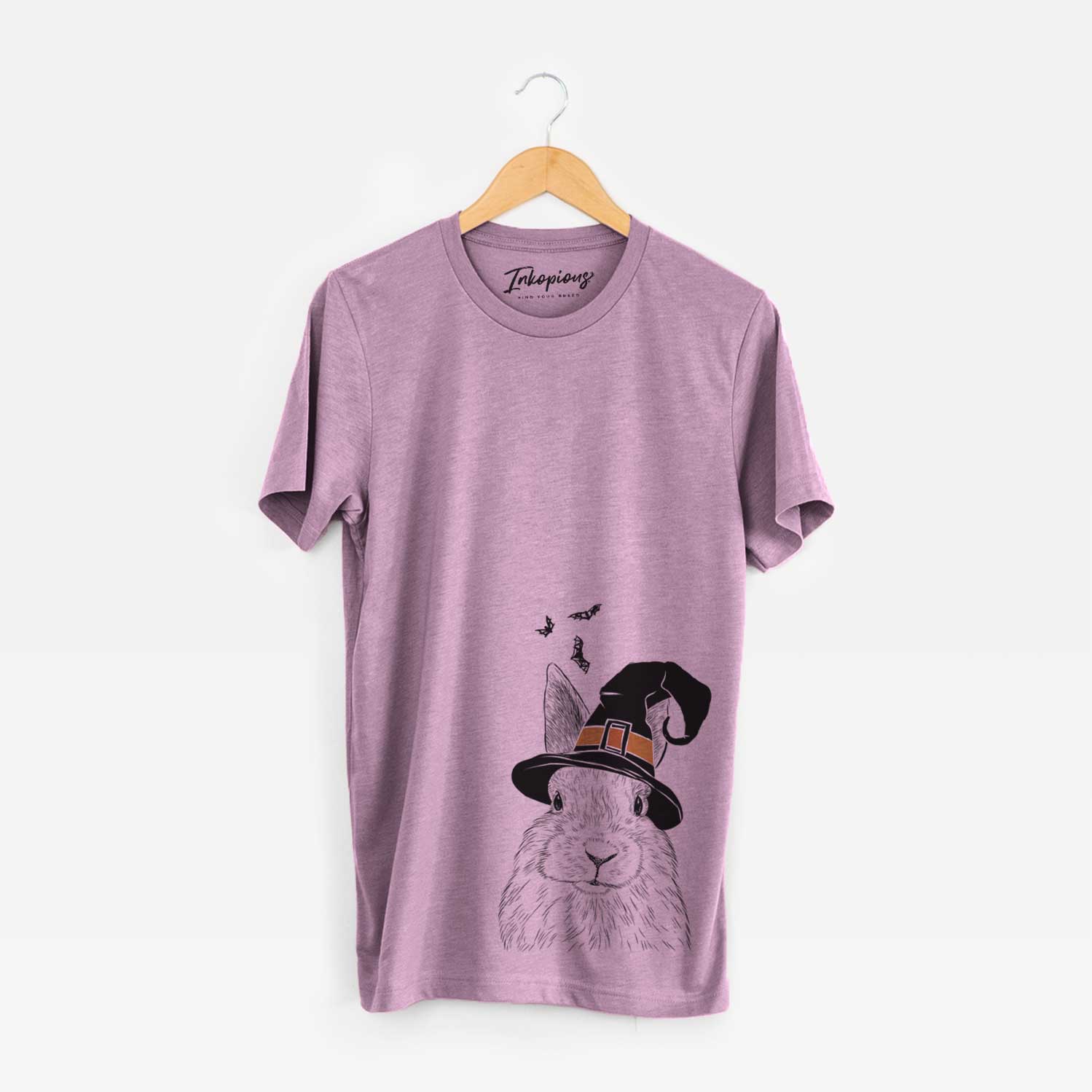 Hand-drawn sketch of Flower the Rex Rabbit wearing a witch hat on an Orchid Unisex crewneck