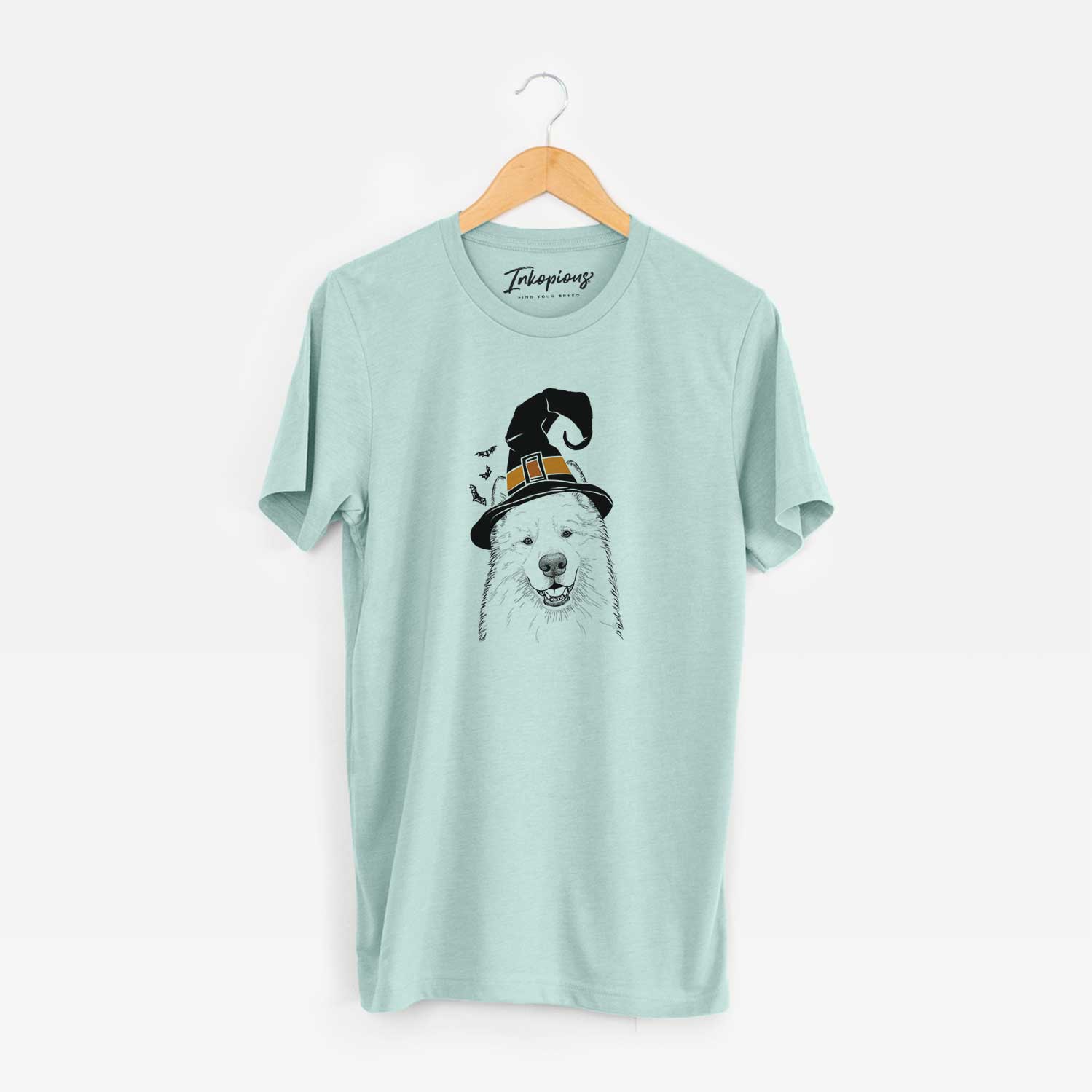 Hand-drawn sketch of Foster the Samoyed wearing a witch hat on a Heather Sage Unisex crewneck