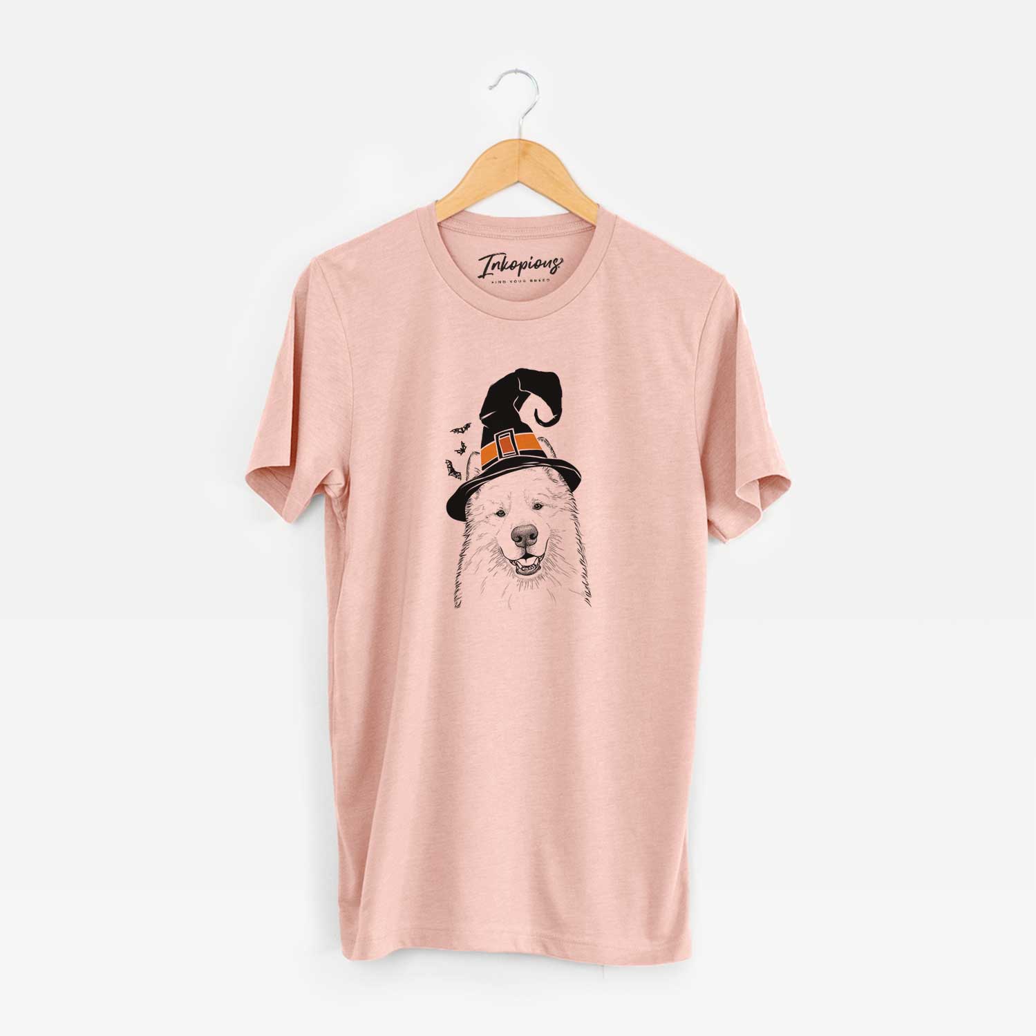 Hand-drawn sketch of Foster the Samoyed wearing a witch hat on a Peach Unisex crewneck