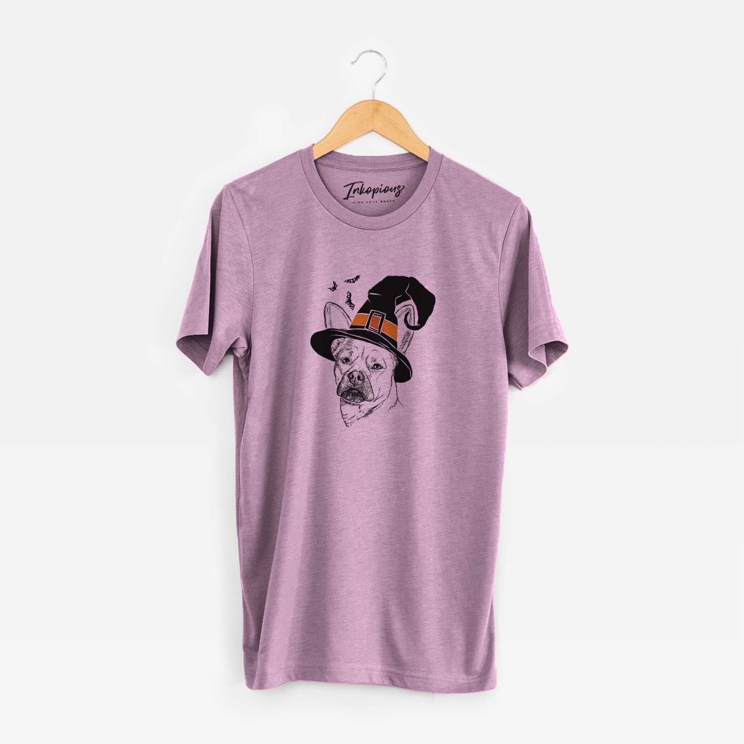 Hand-drawn sketch of Frankie the Mixed Breed wearing a witch hat on an Orchid Unisex crewneck