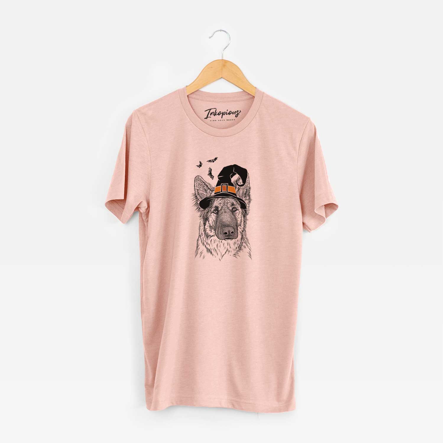 Hand-drawn sketch of Geddy the Shiloh Shepherd wearing a witch hat on a Peach Unisex crewneck
