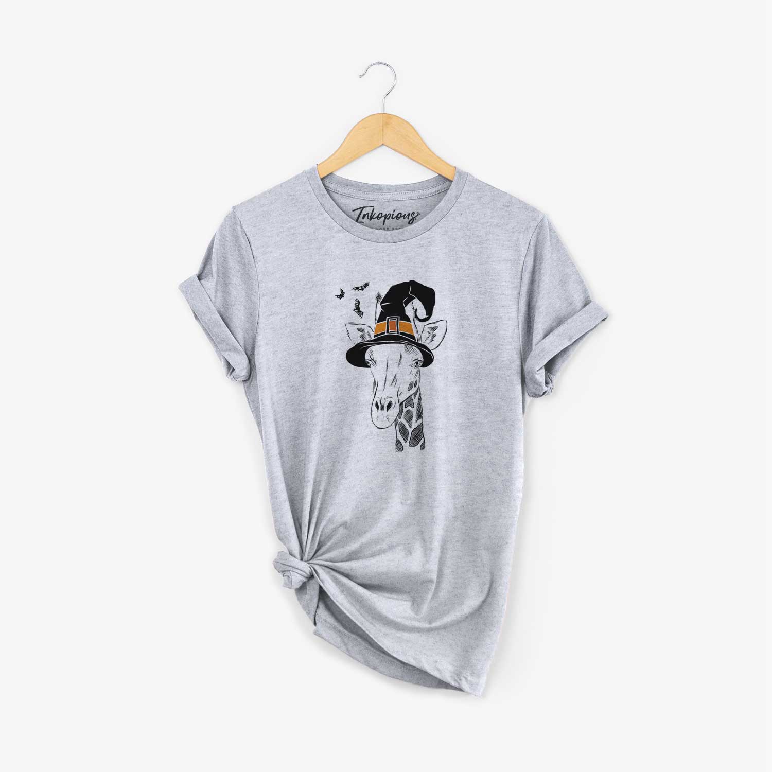 Hand-drawn sketch of Geoffrey the Giraffe wearing a witch hat on a Grey Unisex crewneck