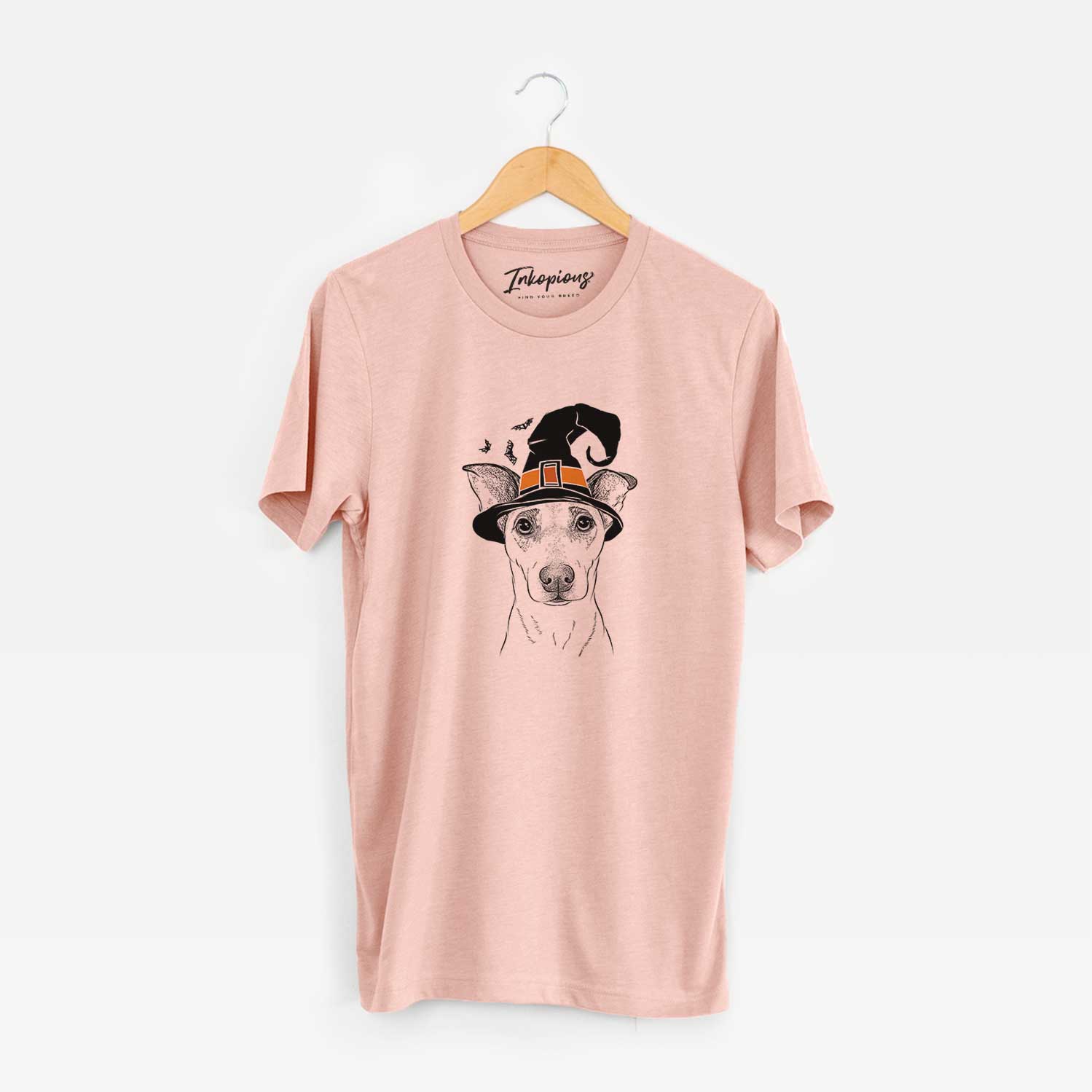 Hand-drawn sketch of Georgie Rat the Terrier Mix wearing a witch hat on a Peach Unisex crewneck