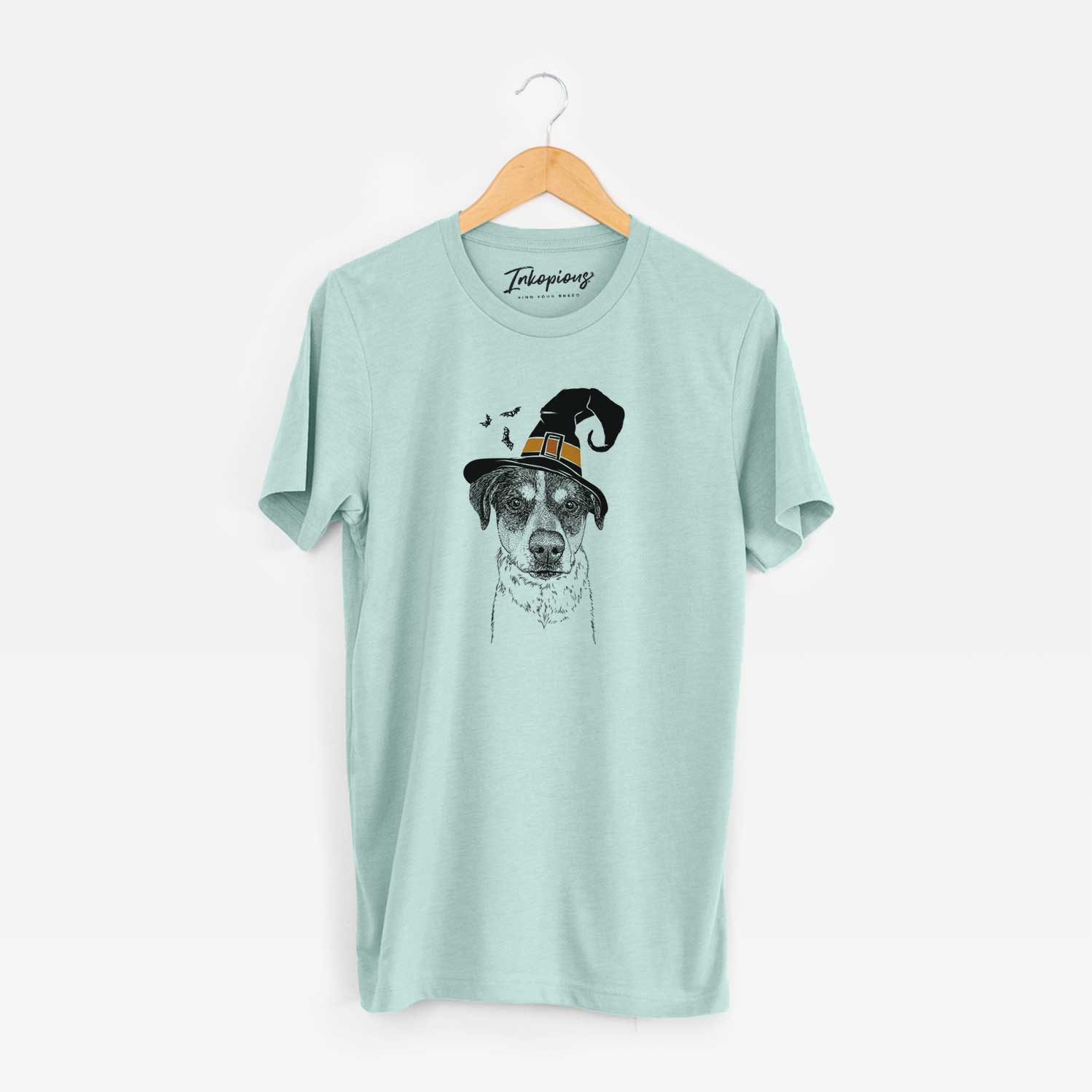 Hand-drawn sketch of Gertrude the Mixed Breed wearing a witch hat on a Heather Sage Unisex crewneck