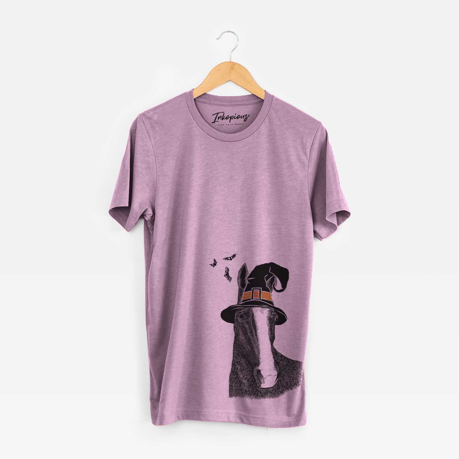 Hand-drawn sketch of Gibson the Tennessee Walking Horse wearing a witch hat on an Orchid Unisex crewneck