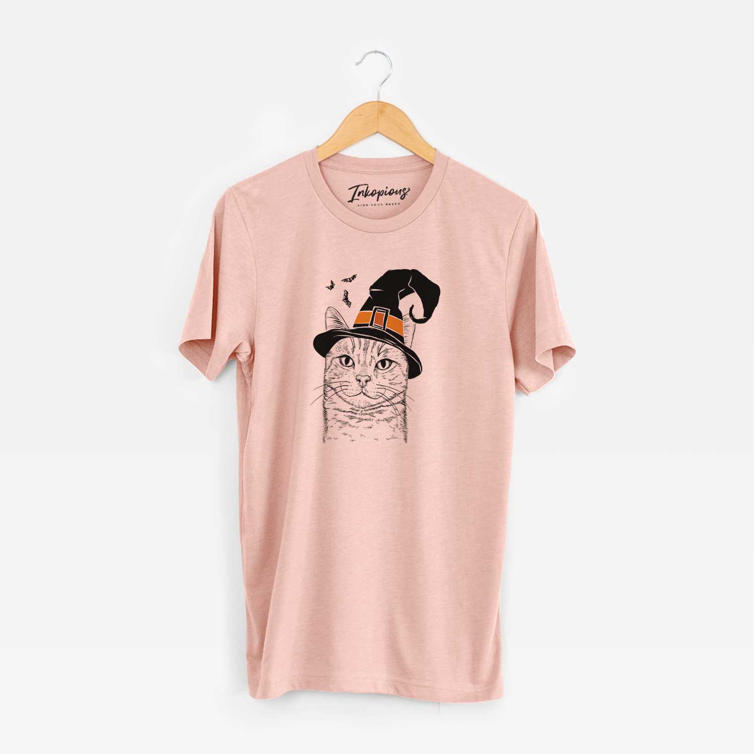 Hand-drawn sketch of Ginger Tom the Tabby Cat wearing a witch hat on a Peach Unisex crewneck