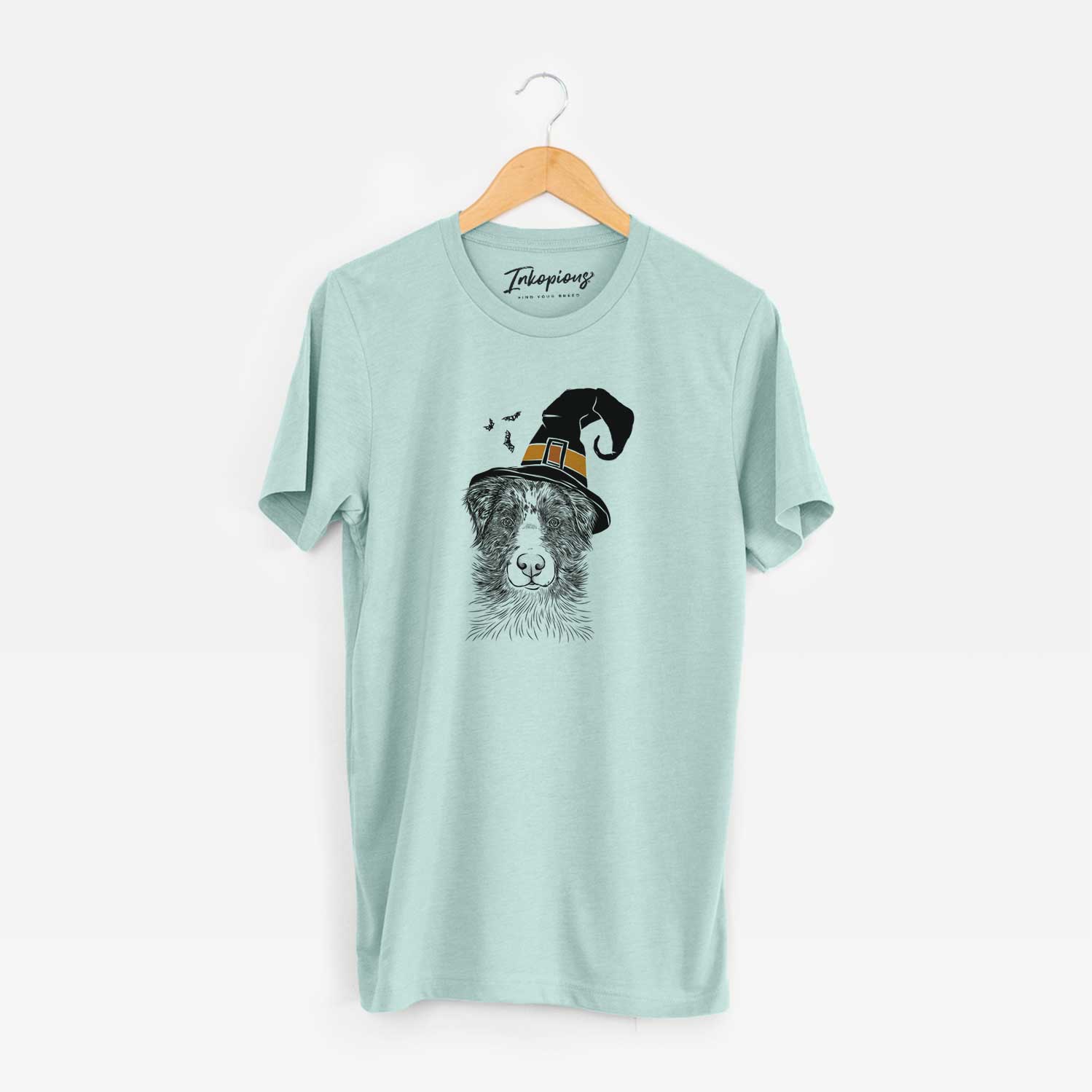 Hand-drawn sketch of Gram the Australian Shepherd wearing a witch hat on a Heather Sage Unisex crewneck