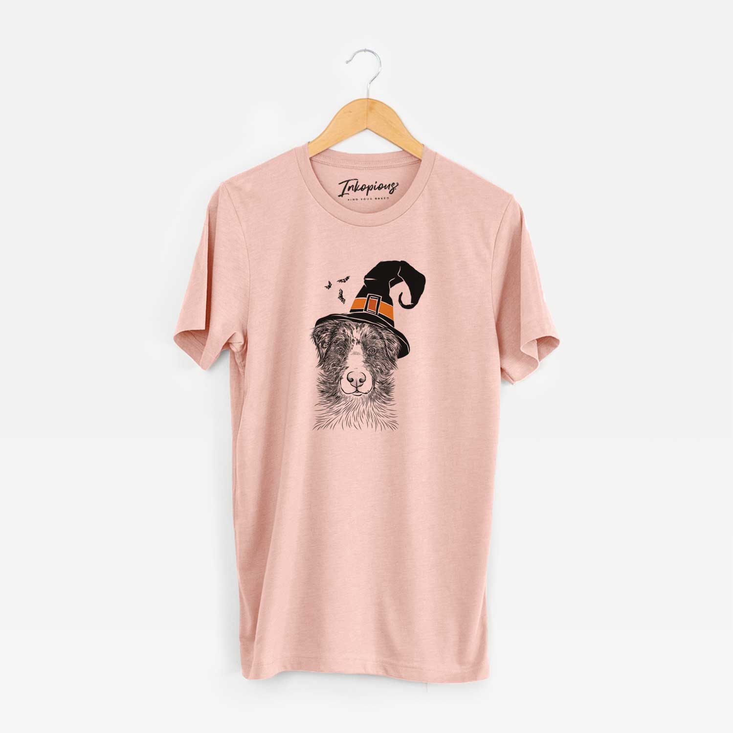 Hand-drawn sketch of Gram the Australian Shepherd wearing a witch hat on a Peach Unisex crewneck