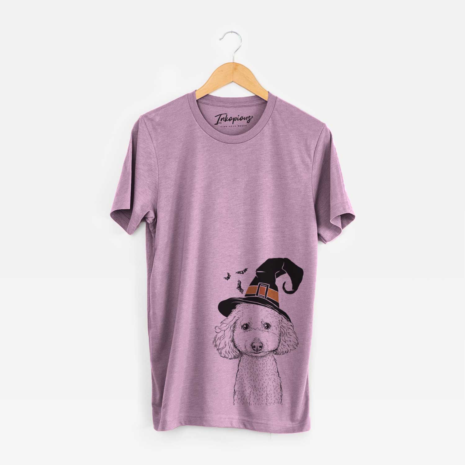 Hand-drawn sketch of Guinness the Toy Poodle Mix wearing a witch hat on an Orchid Unisex crewneck