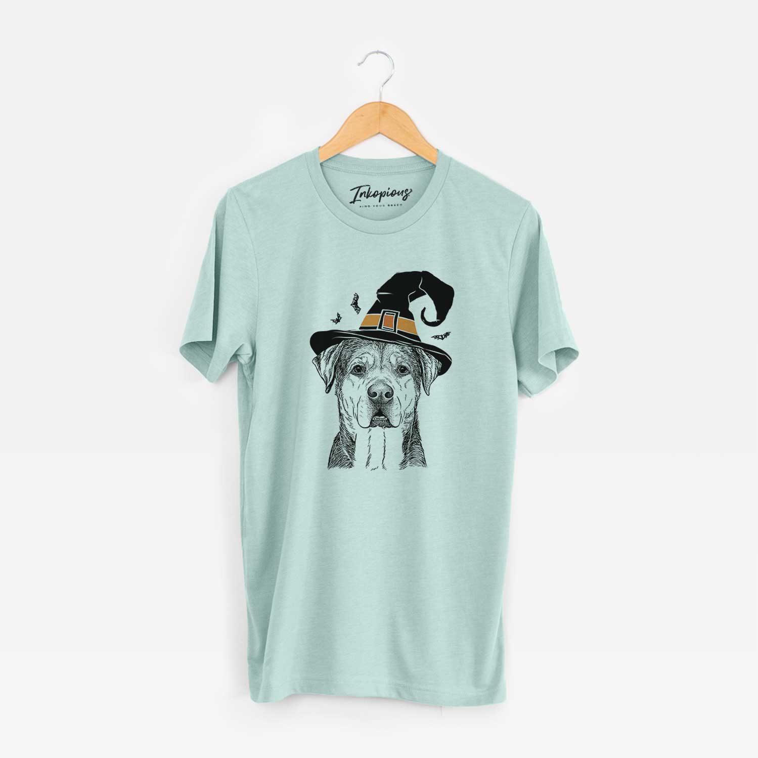 Hand-drawn sketch of Gus the Rottweiler Mix wearing a witch hat on a Heather Sage Unisex crewneck