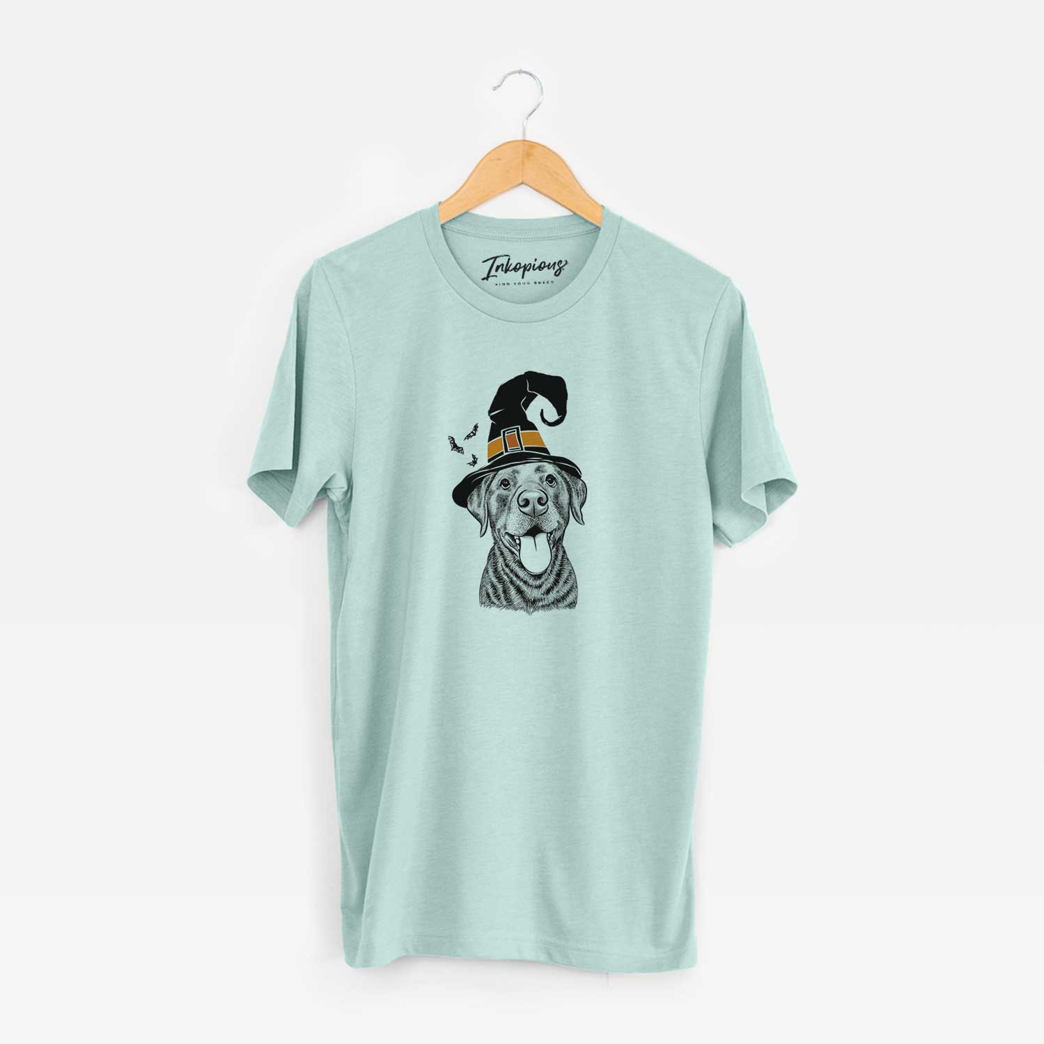 Hand-drawn sketch of Gwen the Labrador Retriever wearing a witch hat on a Heather Sage Unisex crewneck