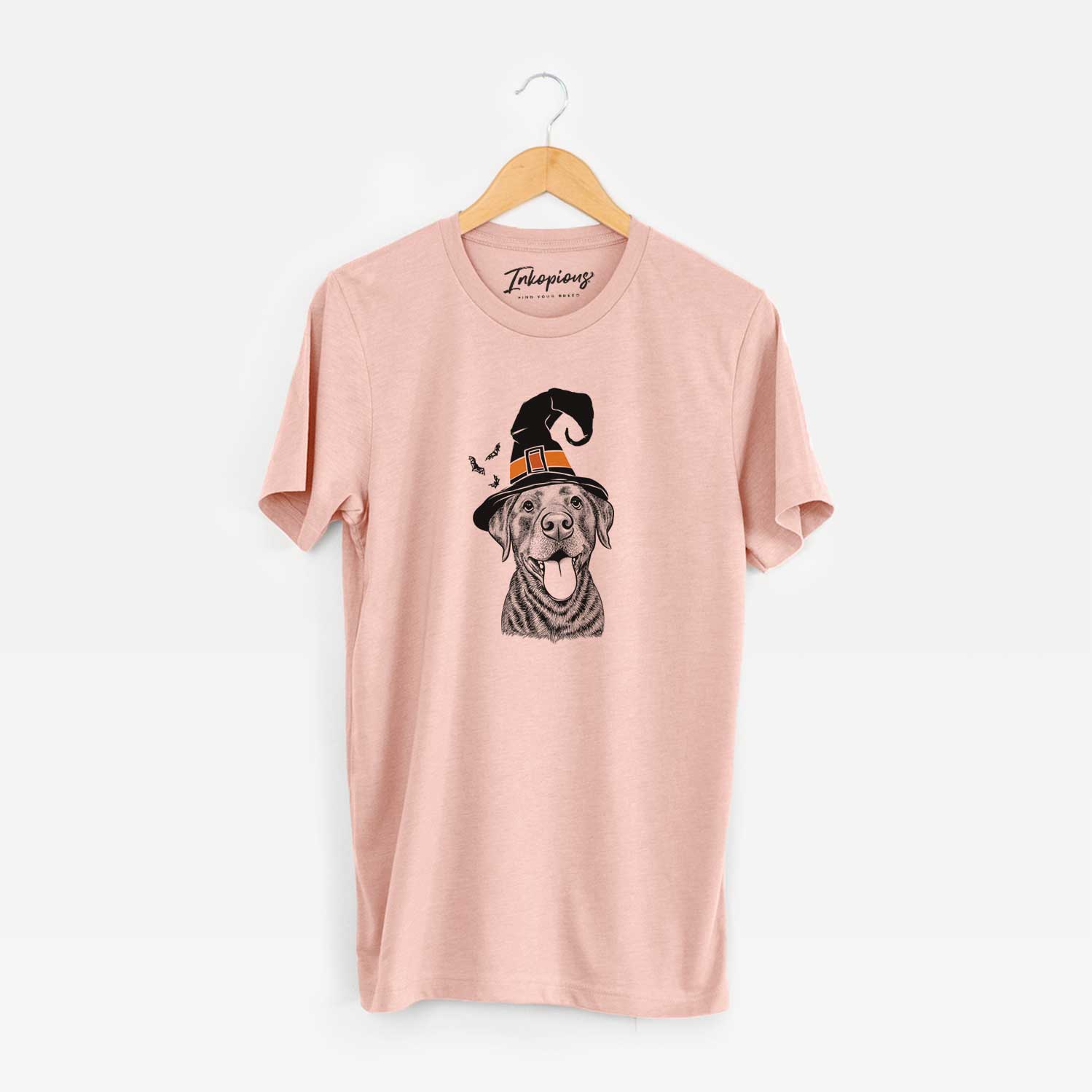 Hand-drawn sketch of Gwen the Labrador Retriever wearing a witch hat on a Peach Unisex crewneck